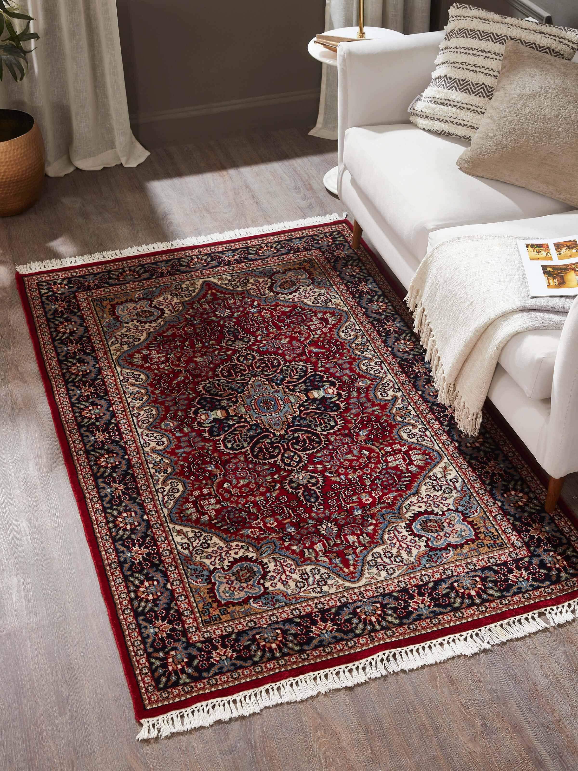 Traditional Persian red Gwalior wool carpet styled in heritage-inspired room décor
