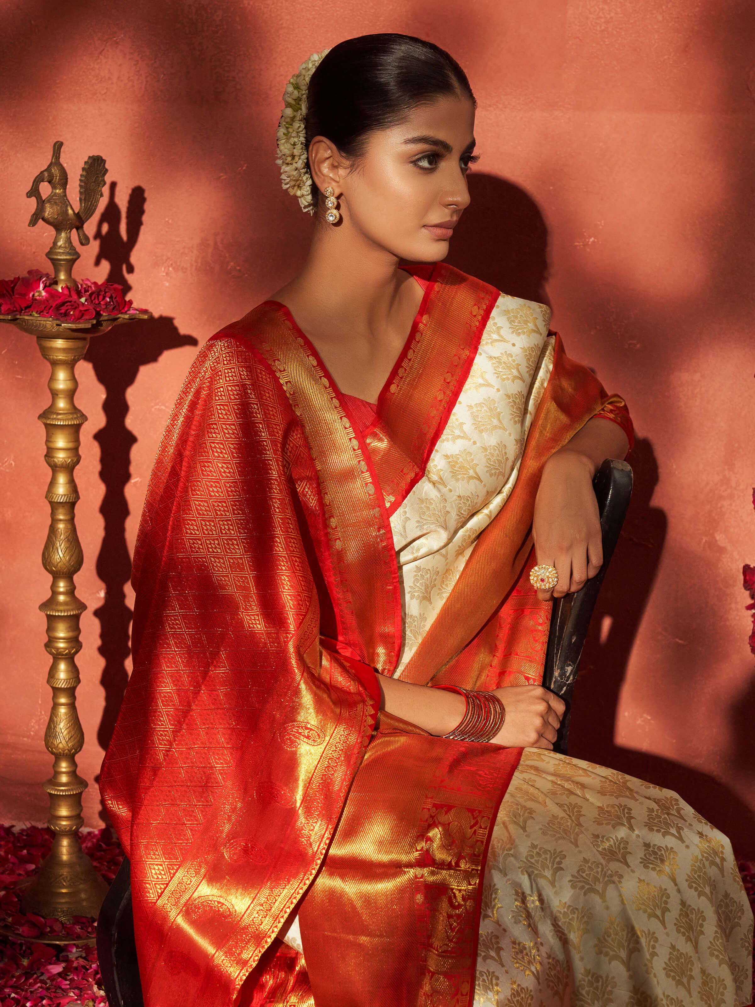 Angled view of white silk Dharmavaram saree highlighting woven patterns