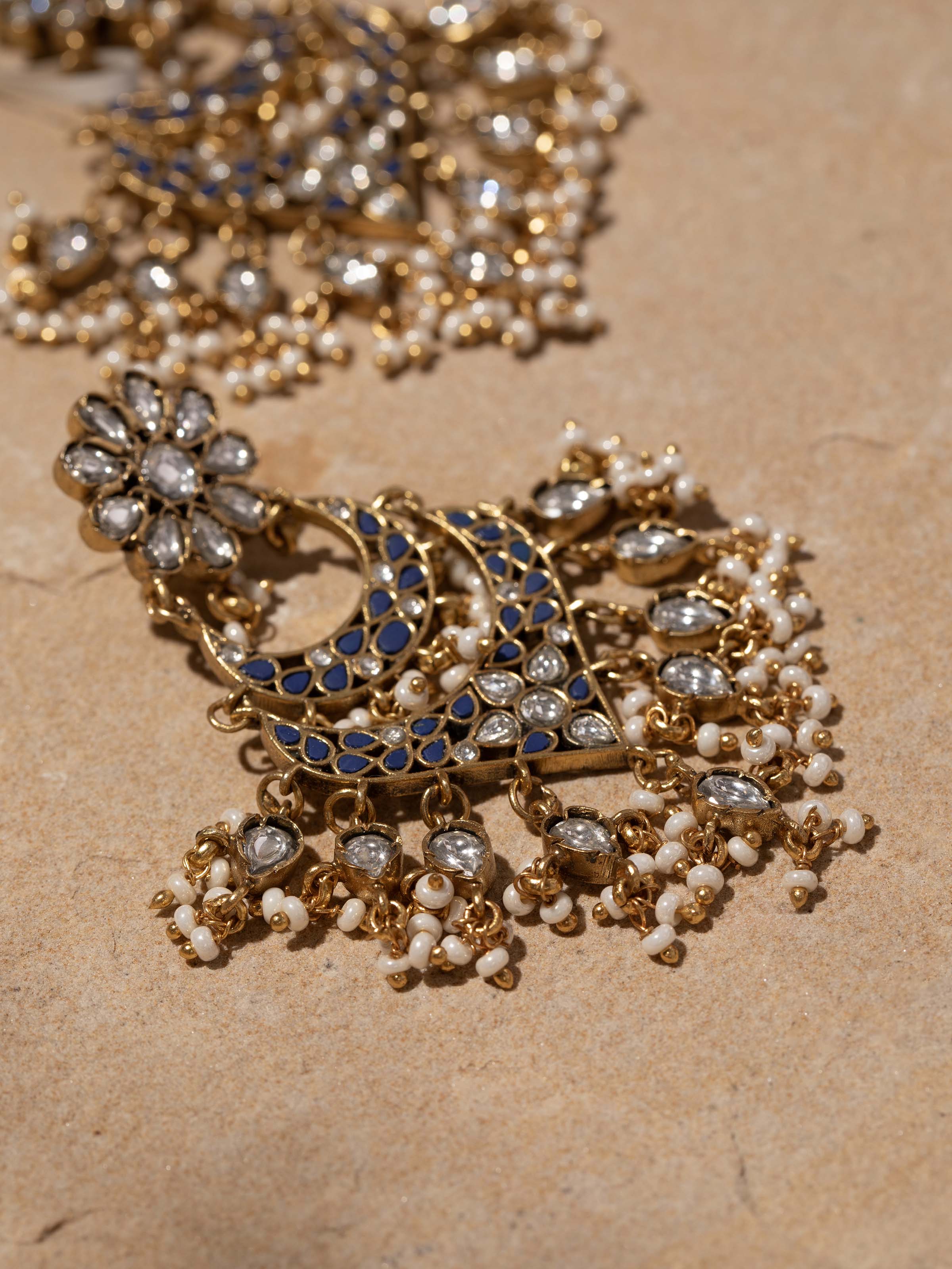 Artistic angled view showing depth and texture of the earrings