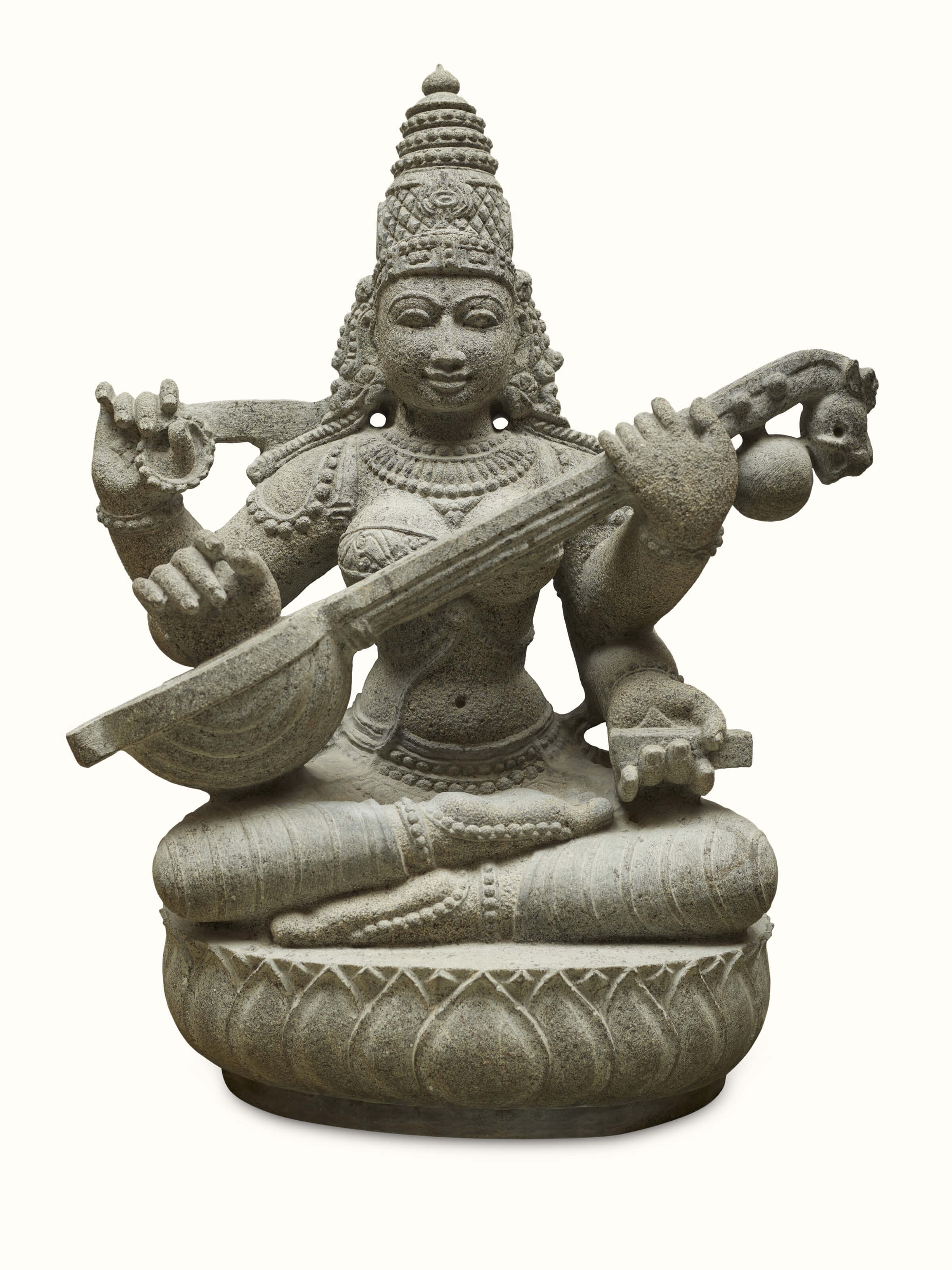 Graceful carved stone goddess Saraswati idol, showcasing detailed craftsmanship and serene expression.
