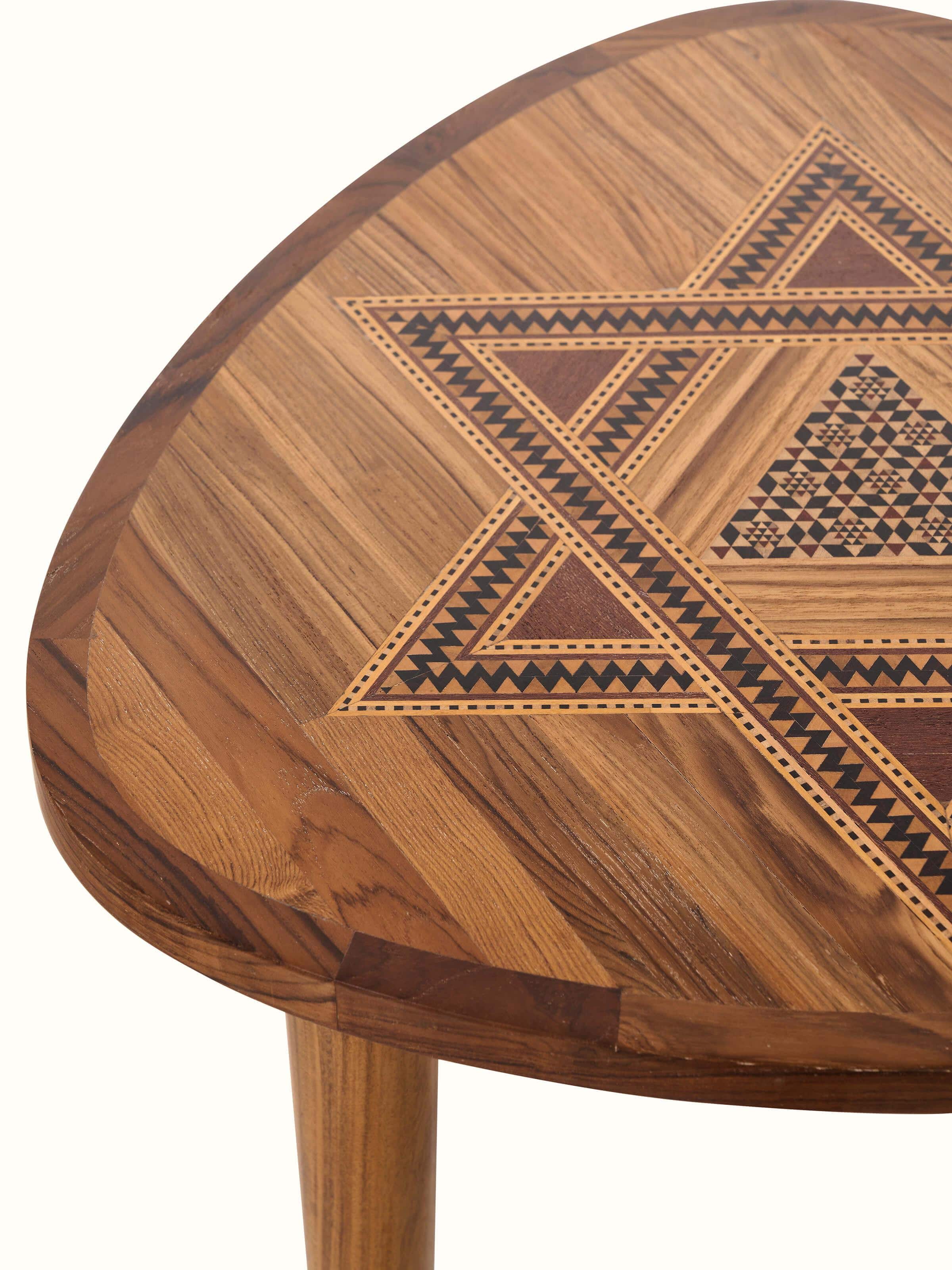 Close-up of the teak wood marquetry end & side table, focusing on the wood grain and design details.