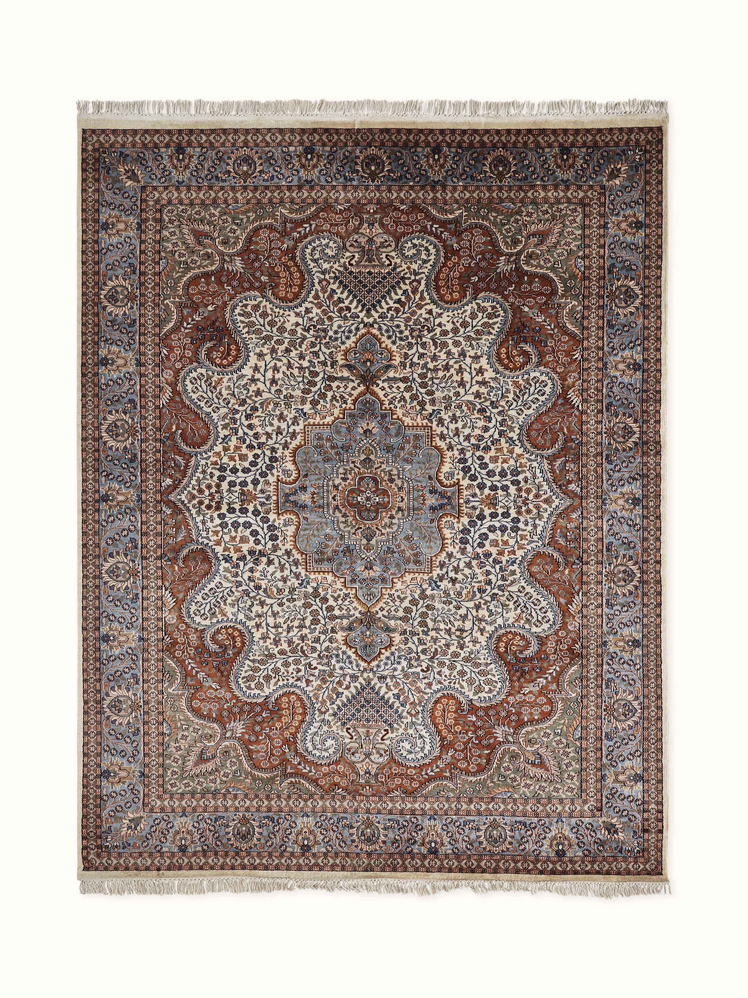 A front view of another Persian Tabriz Gwalior wool carpet showcases rich colors and classic motifs.