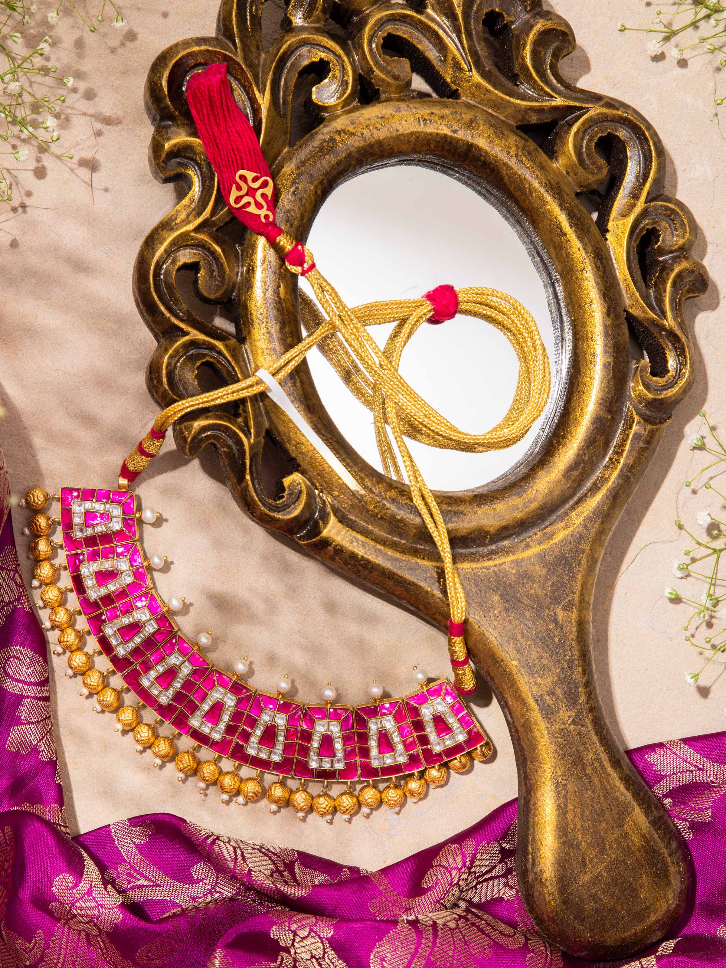 Side view of Silver Smithing Collar Necklace highlighting the smooth curves and intricate silver detailing.