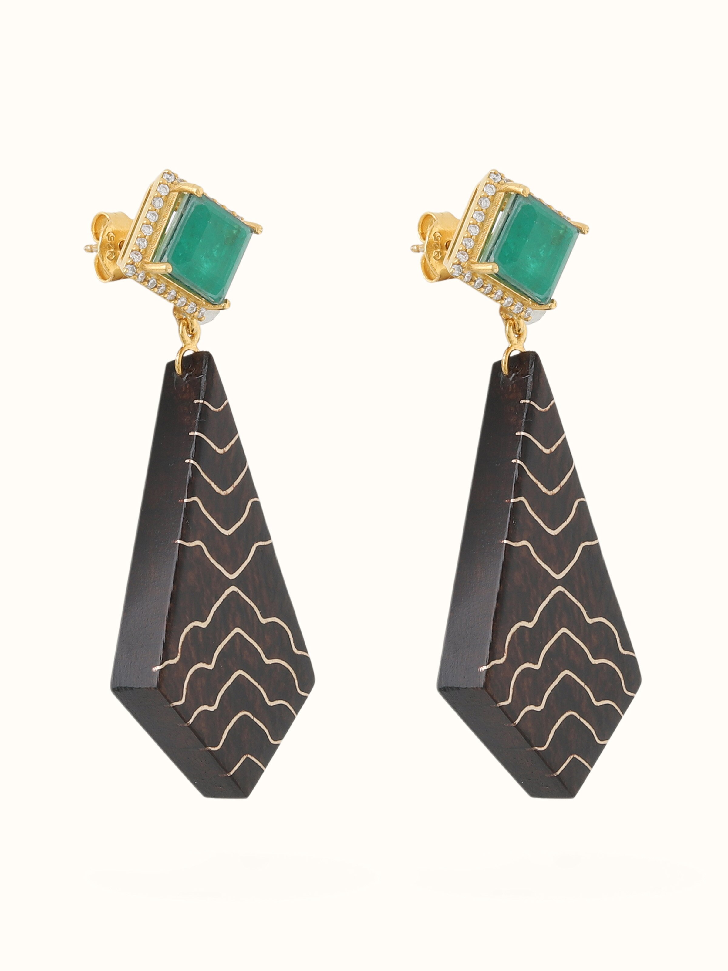 Angled view of Tarkashi silver drop earrings