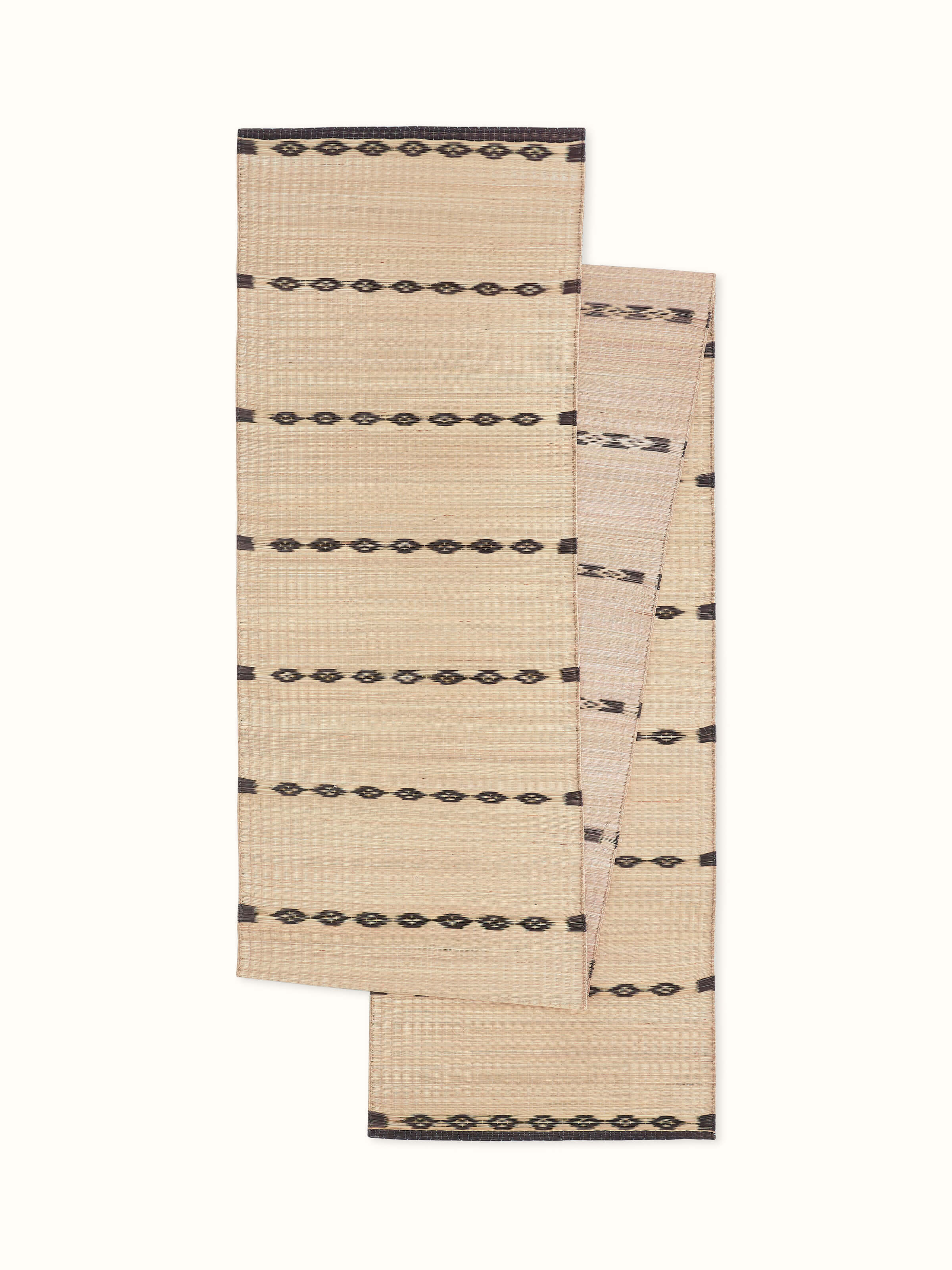 Front view of Prakriti black stripe natural fibre Madurkathi table runner for 6-seater, showcasing traditional handwoven texture.