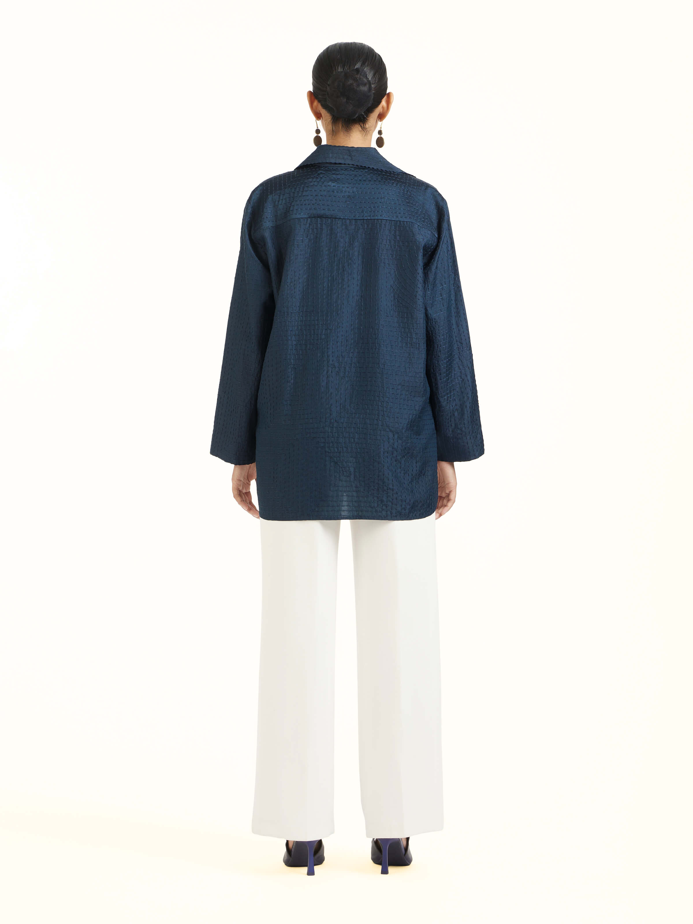 Back view of blue silk kantha shirt displaying overall design