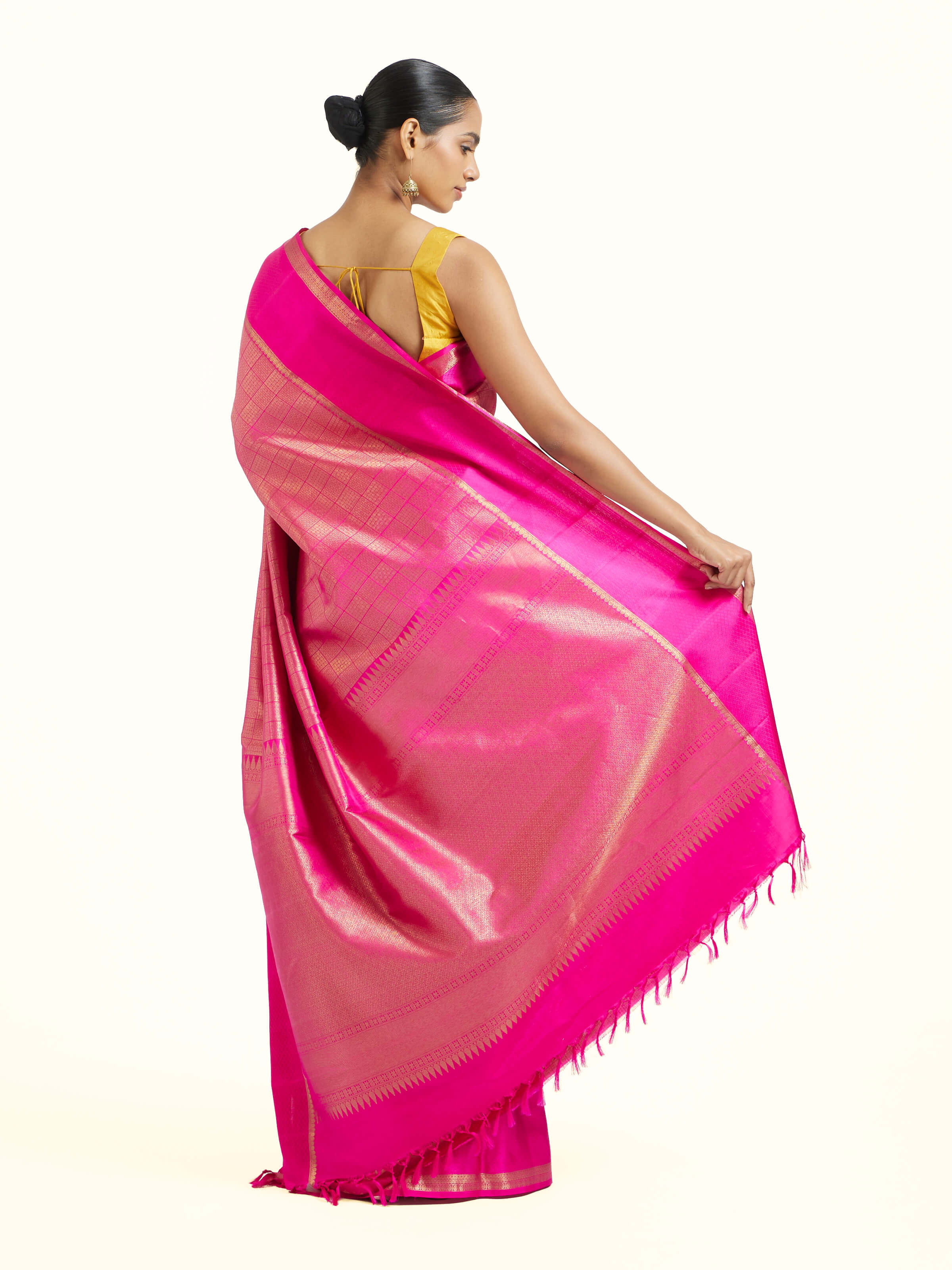 Back view of pink silk Kancheepuram saree displaying ornate pallu design