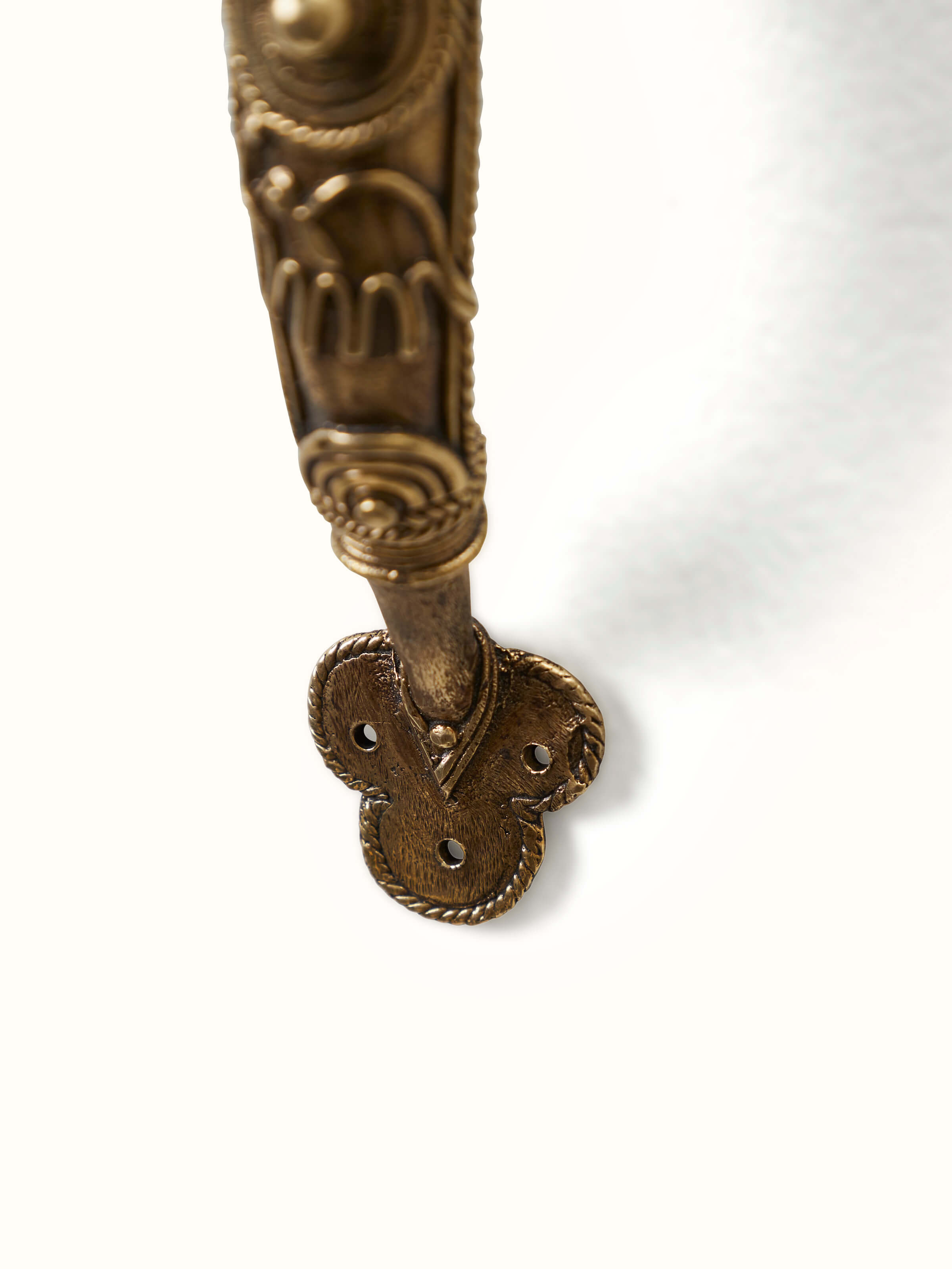 Angled view of Dhokra Brass Animal Door Handle highlighting the unique design and detailed brass finish