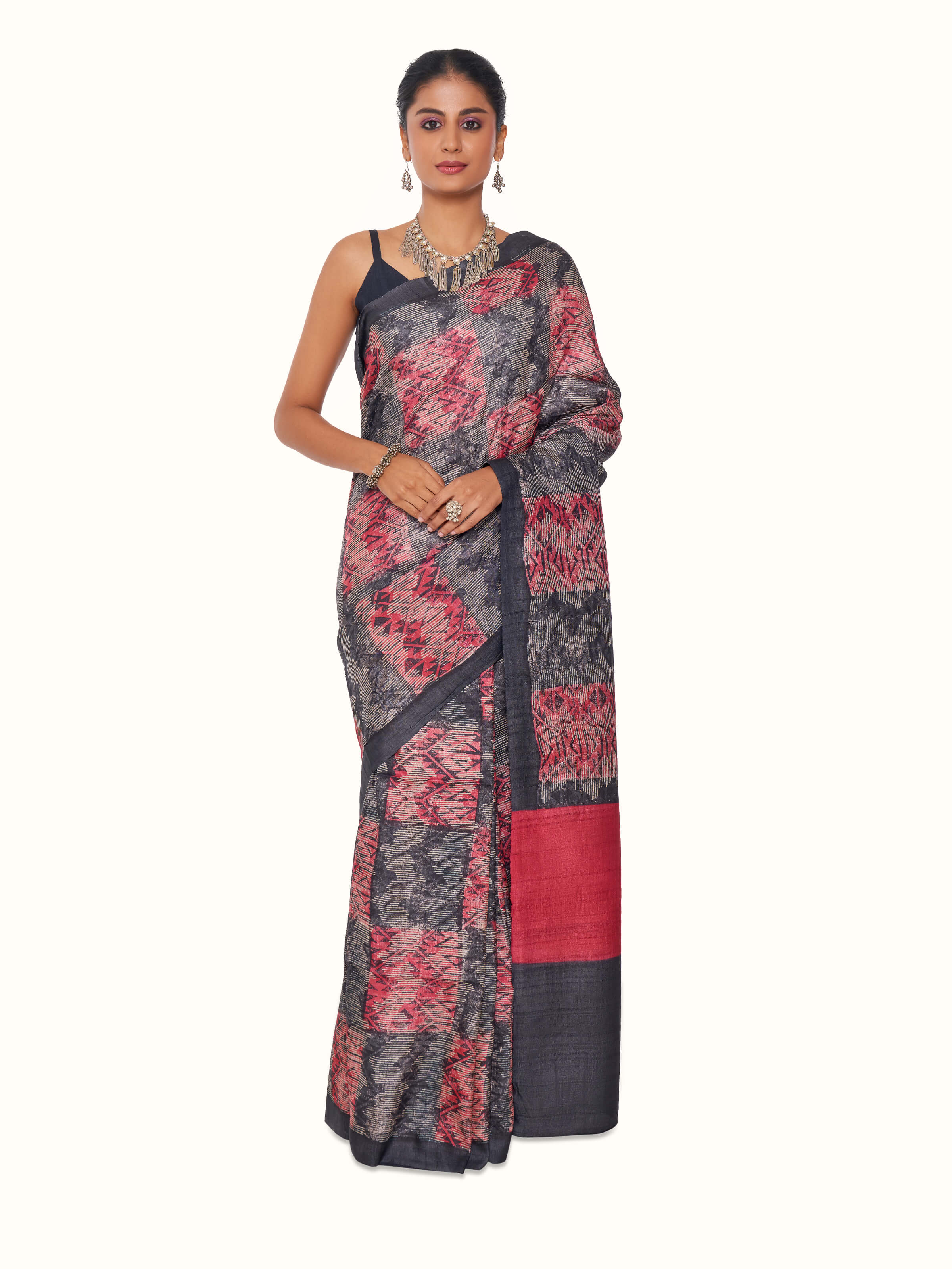 Front view of black tussar silk discharge block printed saree with artisan motifs