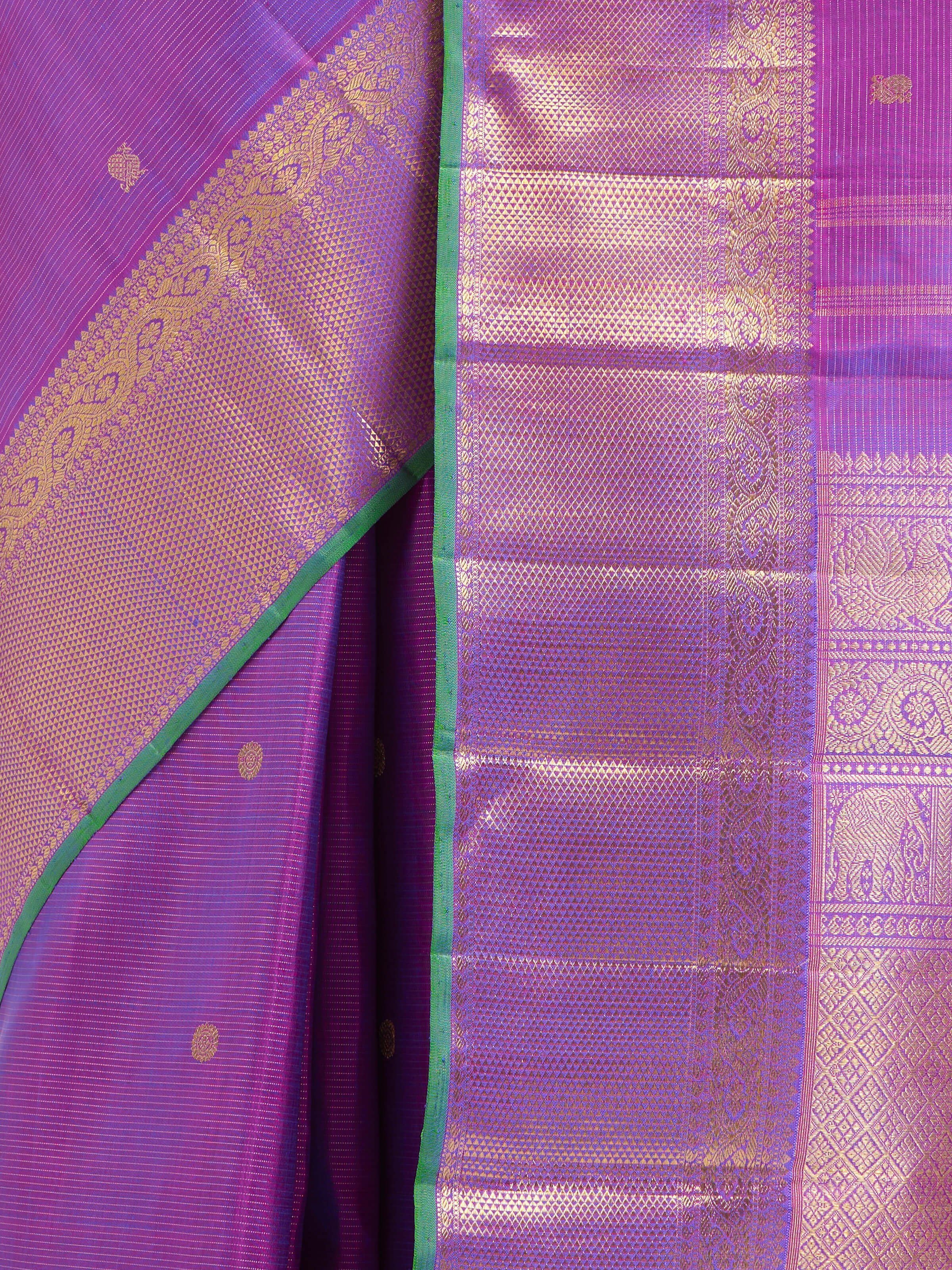 Detail view of purple silk Kancheepuram saree showing zari work