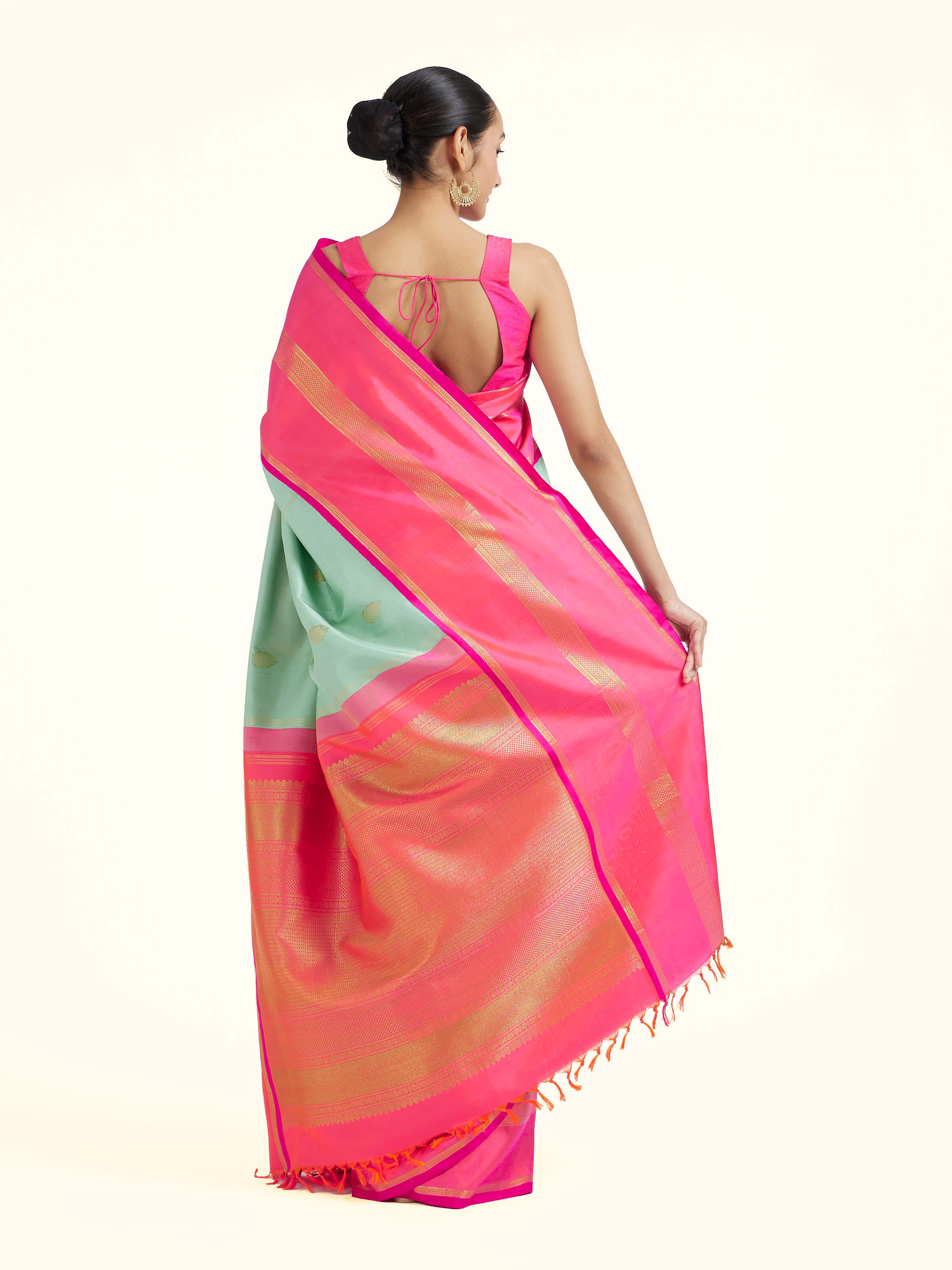 Back view of light blue silk Kancheepuram saree displaying ornate pallu design