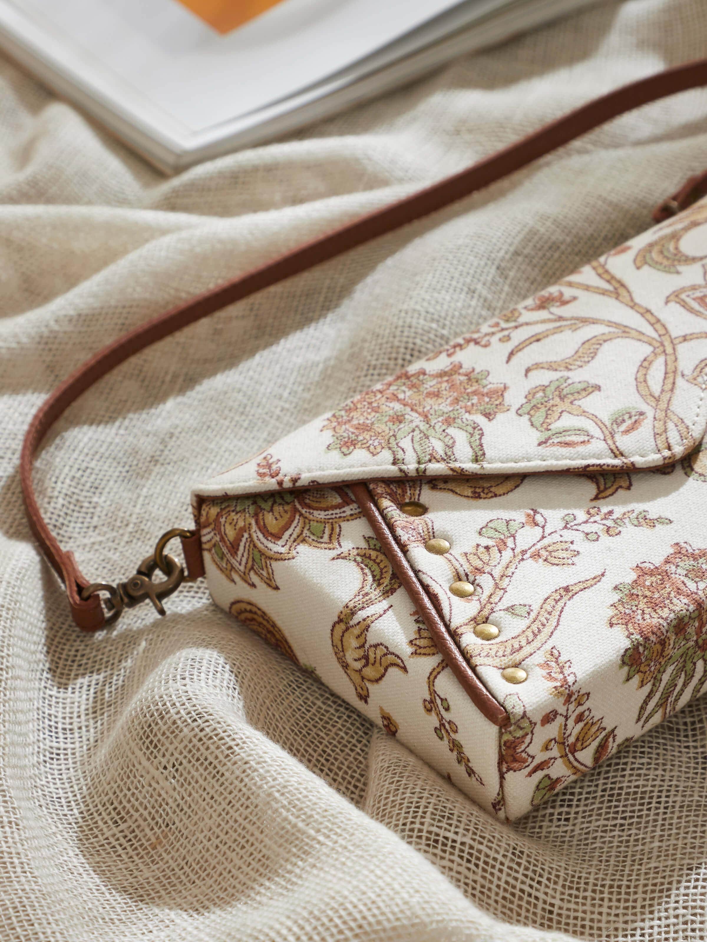 Side view showing mustard leather and block print textile sling bag profile