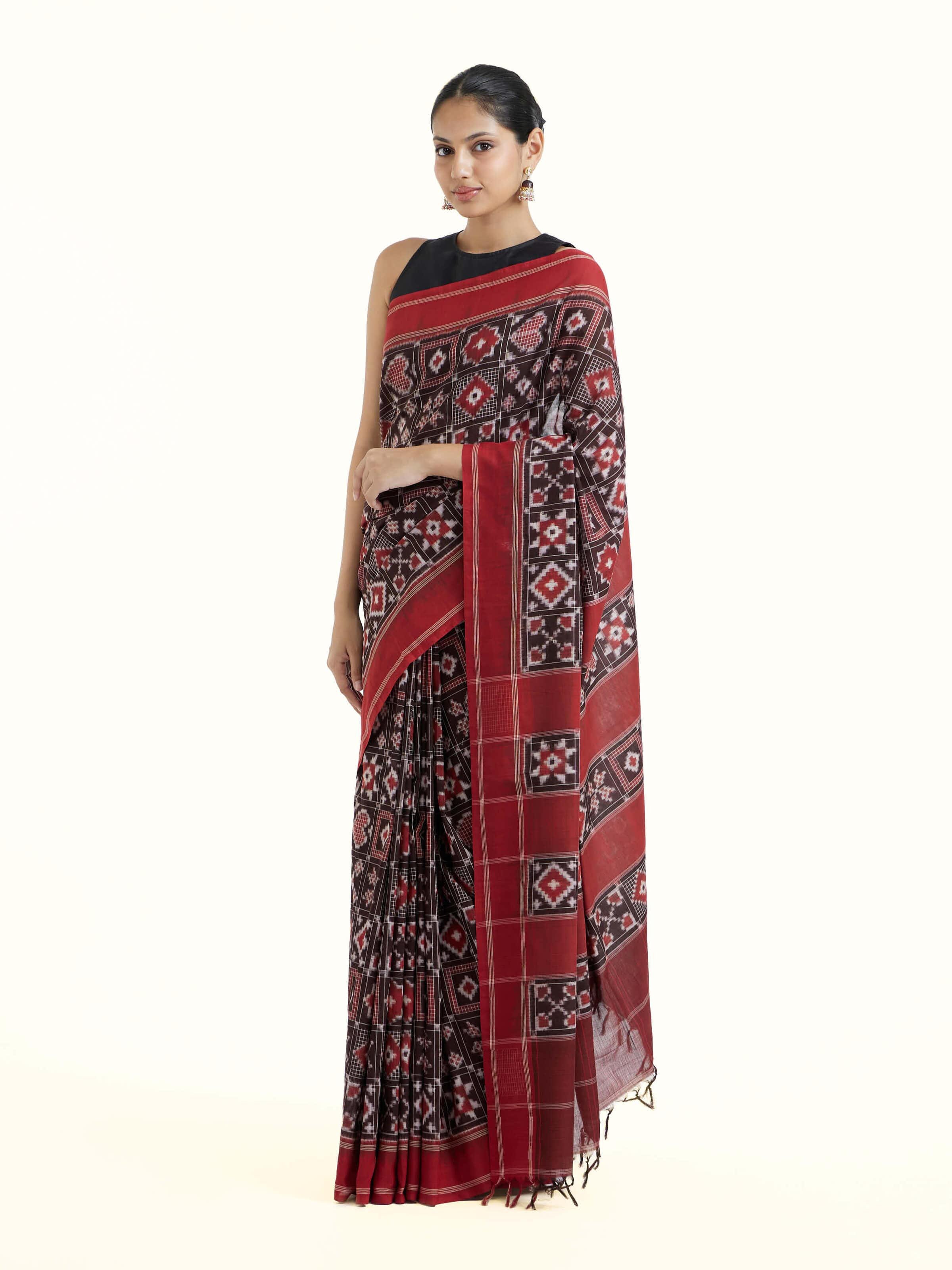 Side view of madder red cotton double ikat saree highlighting comfortable drape
