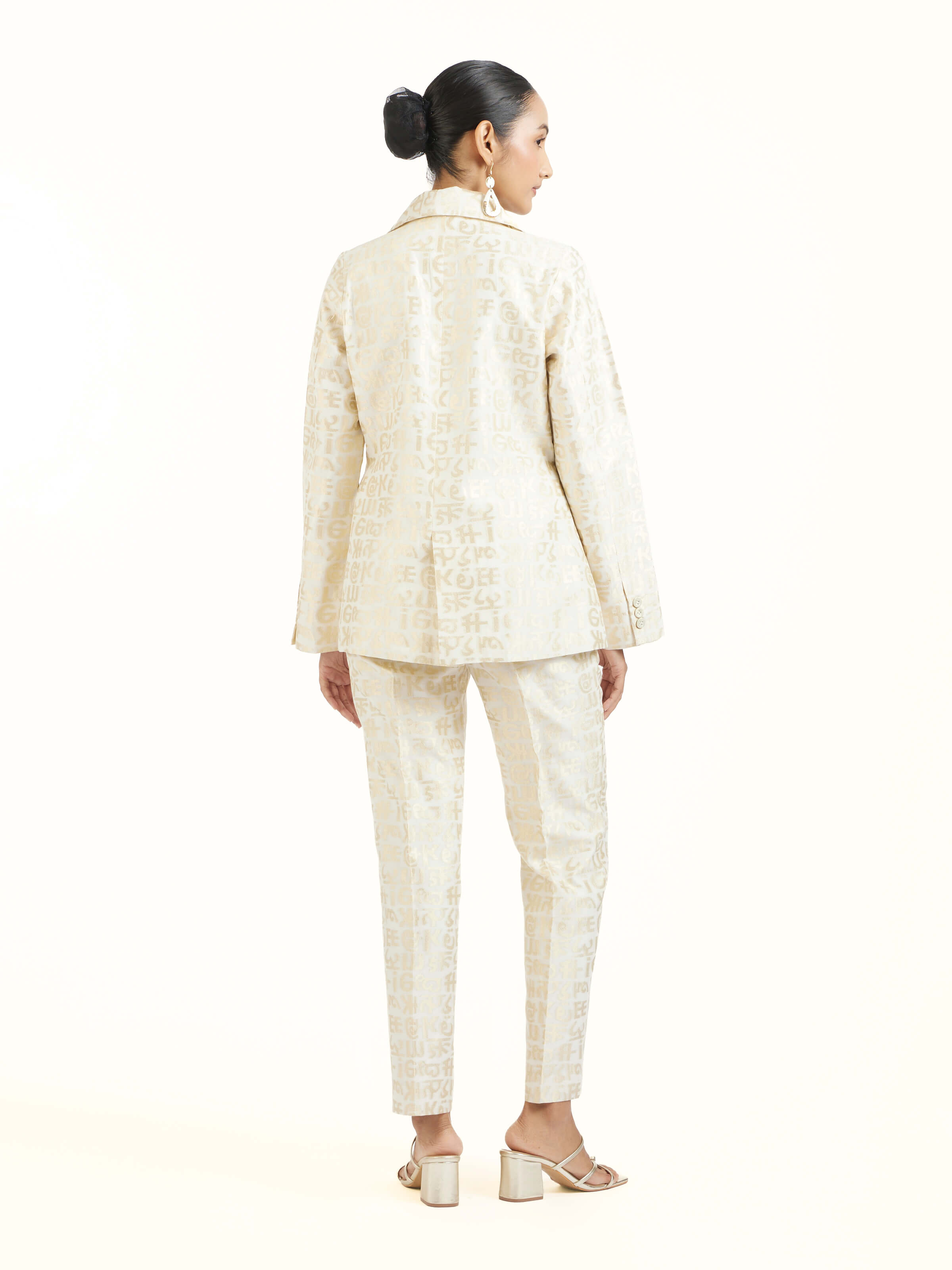 Back view of ivory handloom cut work calligraphy co-ord set displaying complete ensemble