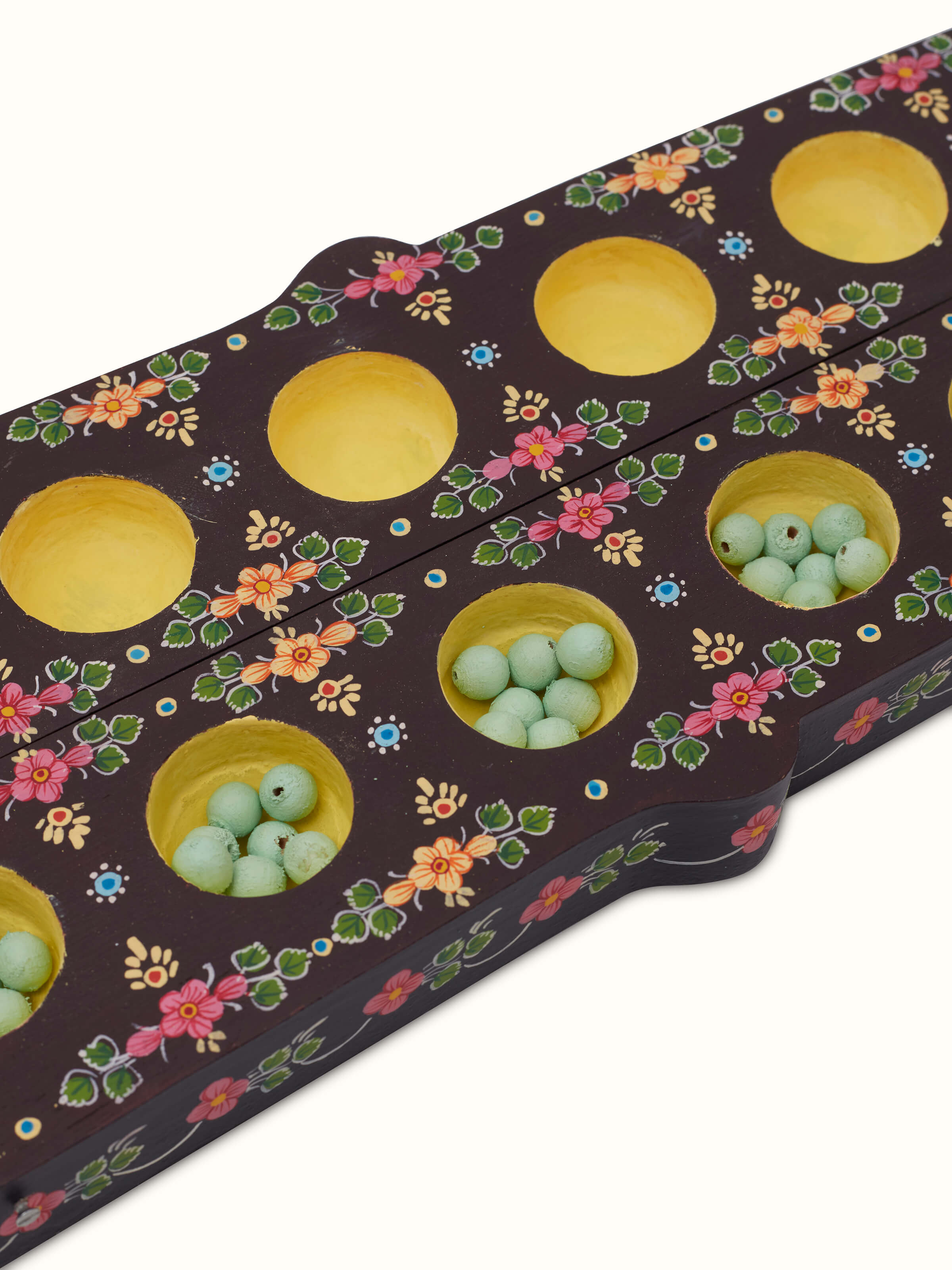 Detailed view of Ganjifa cedar wood 3-in-1 mancala board game, focusing on the smooth wood finish and precise game layout