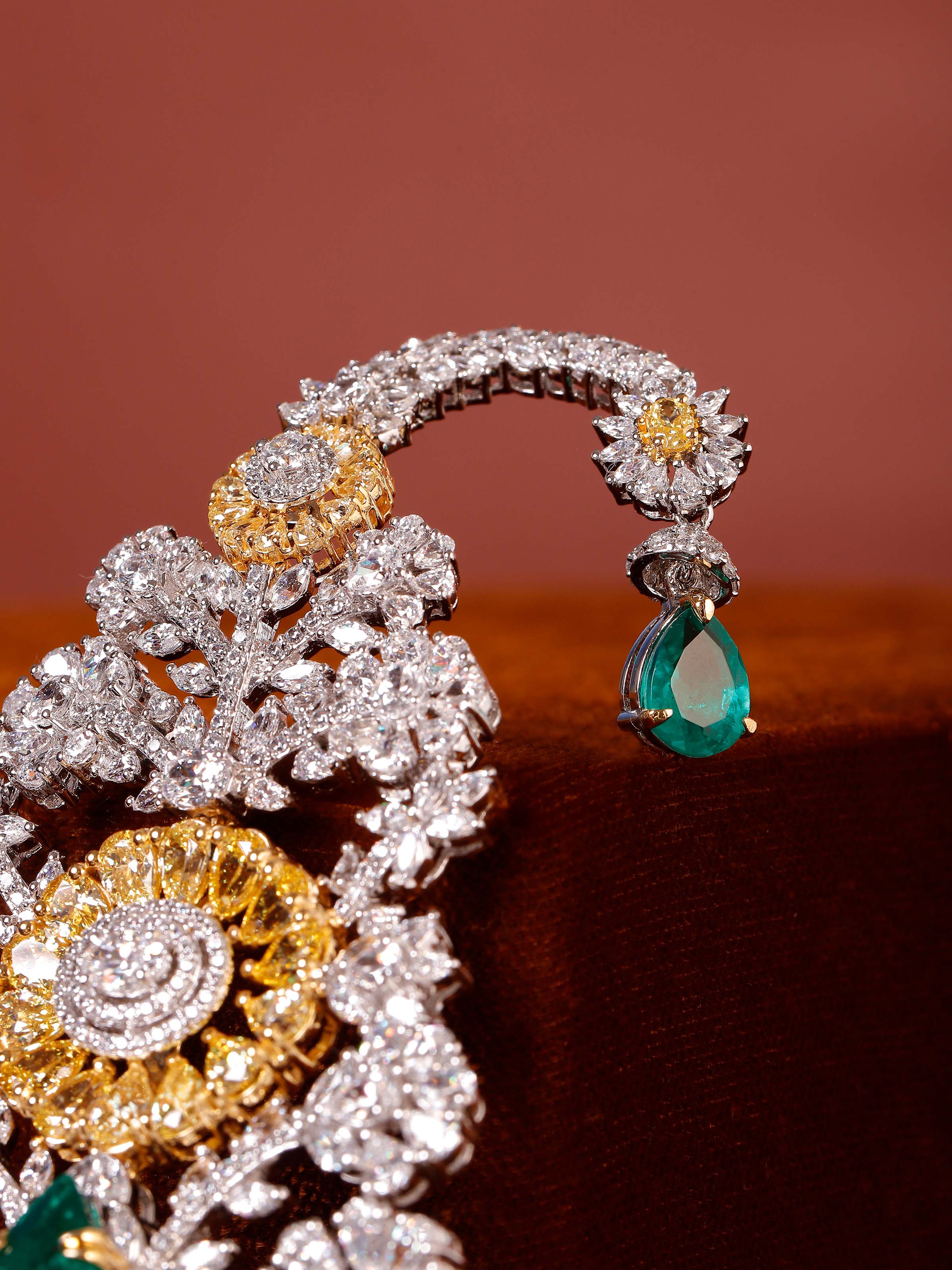 detail view of silver smithing multi colour brooch pin pattern