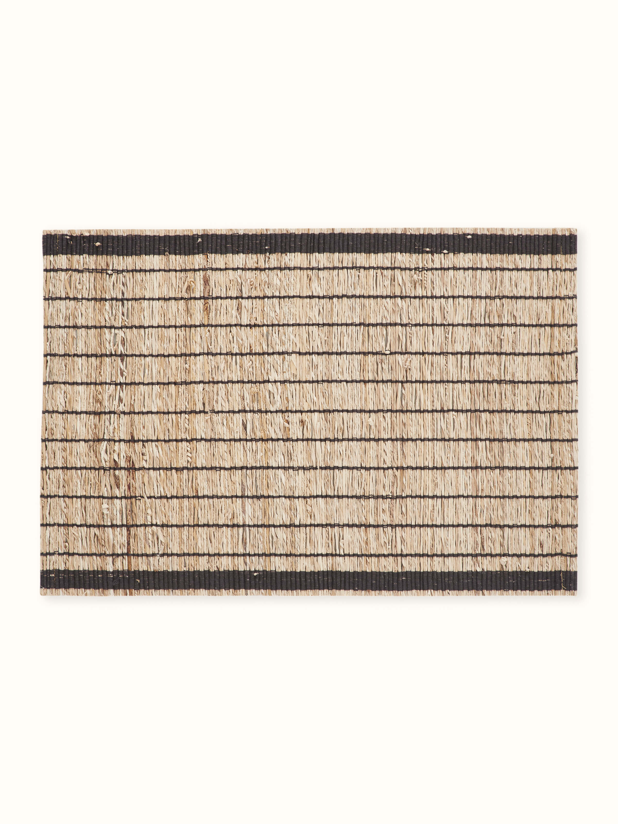 Angled close-up showing the natural banana fibre texture with bold black stripes
