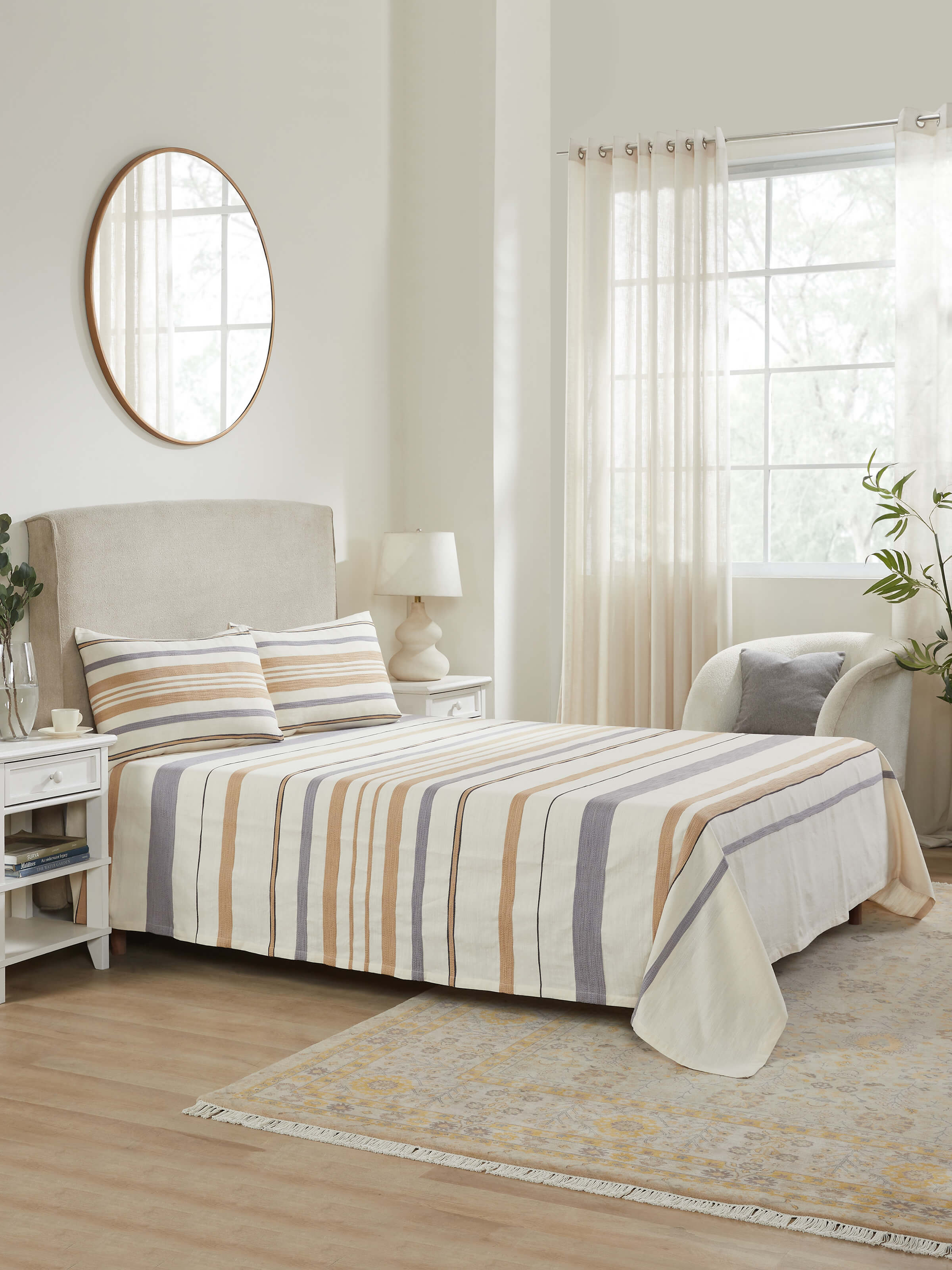 Lifestyle setup showing Neerja striped beige bedspread in handwoven cotton – calm bedroom setting