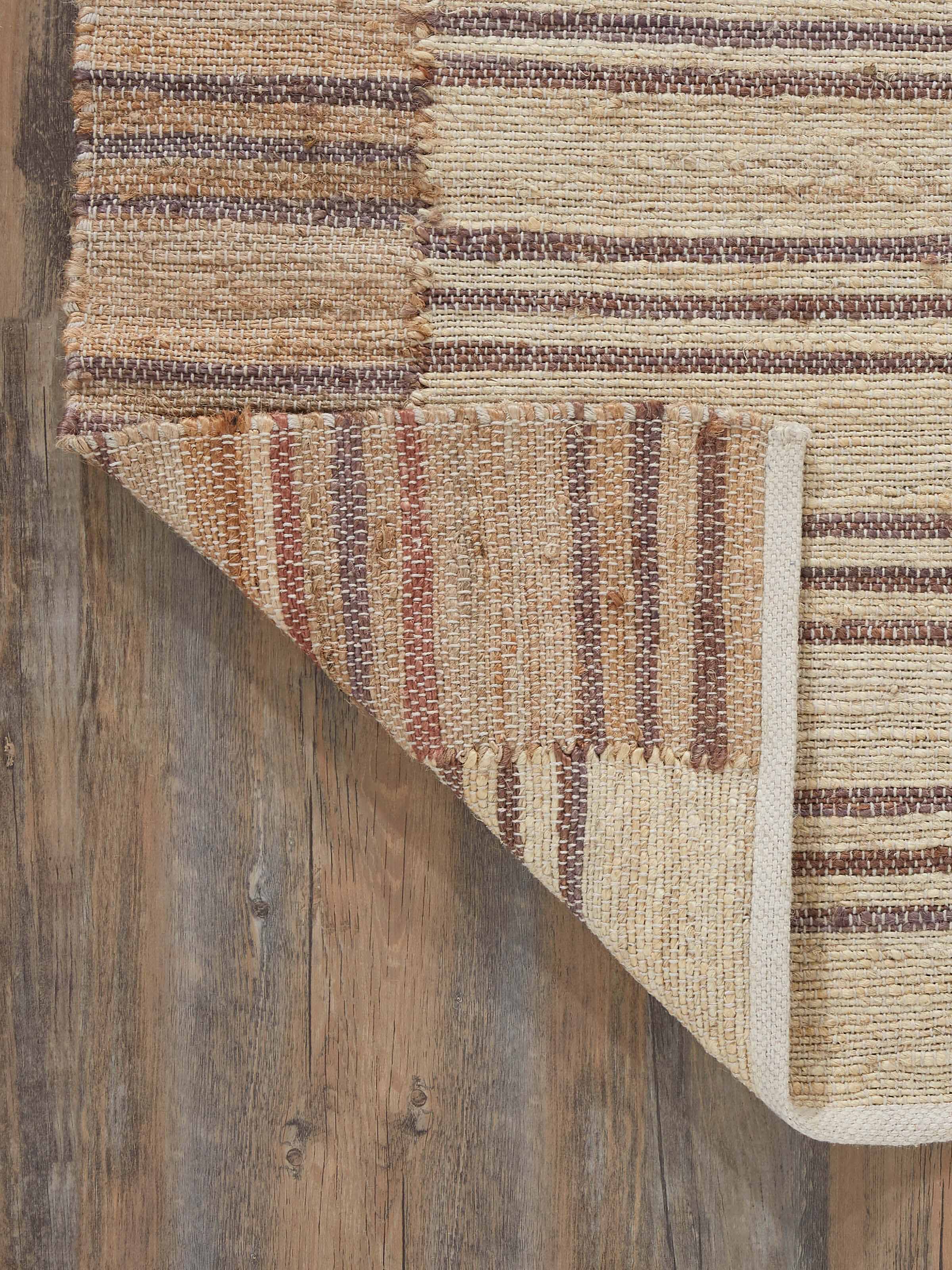 Back view of Textured Stripes Lawan Jute Rug featuring neat edges and sturdy construction