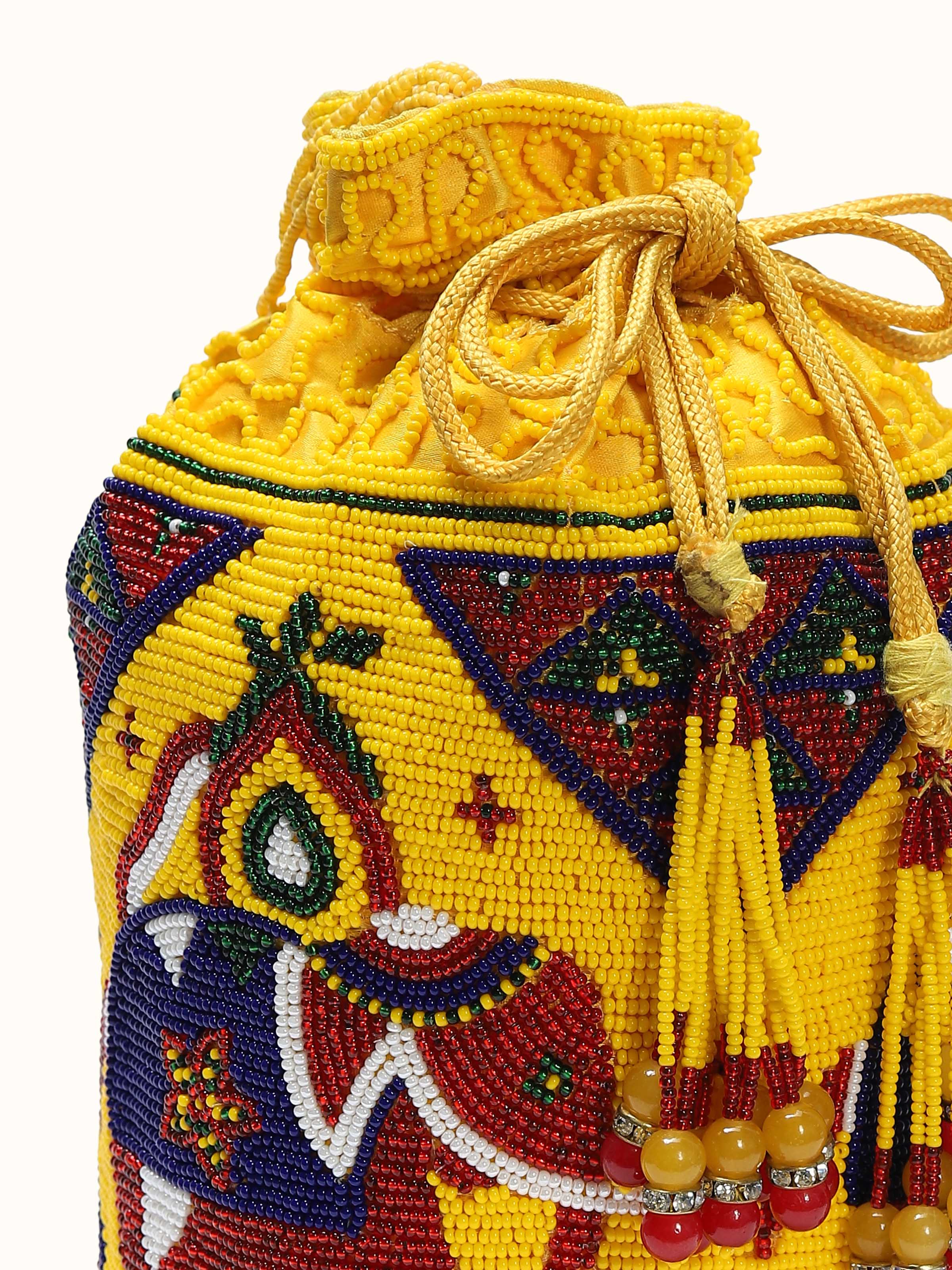 Detail view of silk beadwork potli bag with beadwork texture