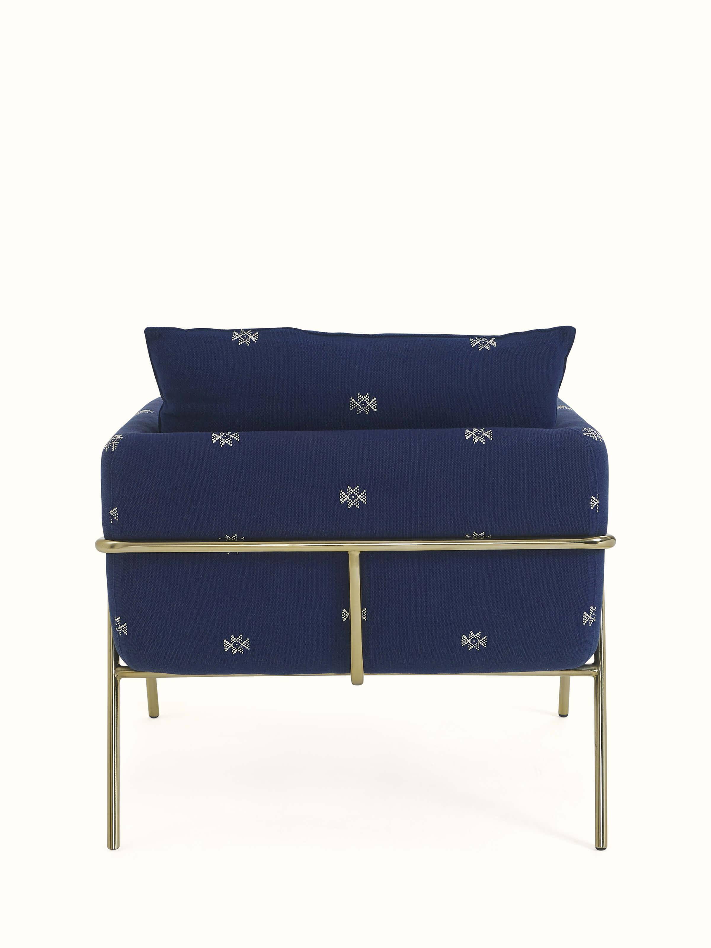 Base view of Upholstered Metal Armchair showcasing the sturdy metal frame and sleek design.