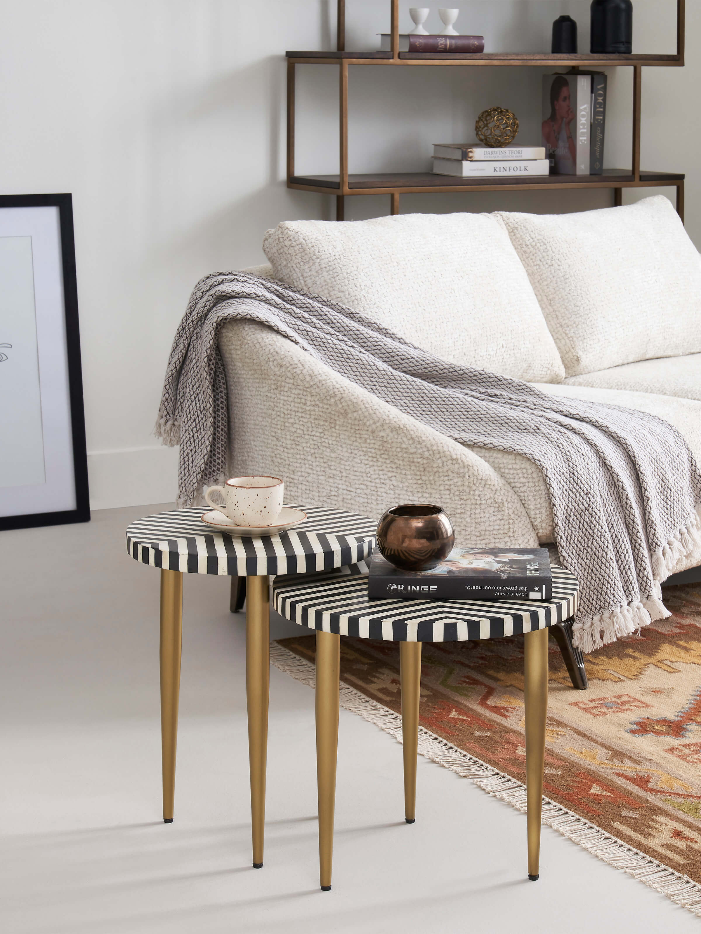 Side view of the bone inlaid nesting tables highlighting the detailed craftsmanship and design