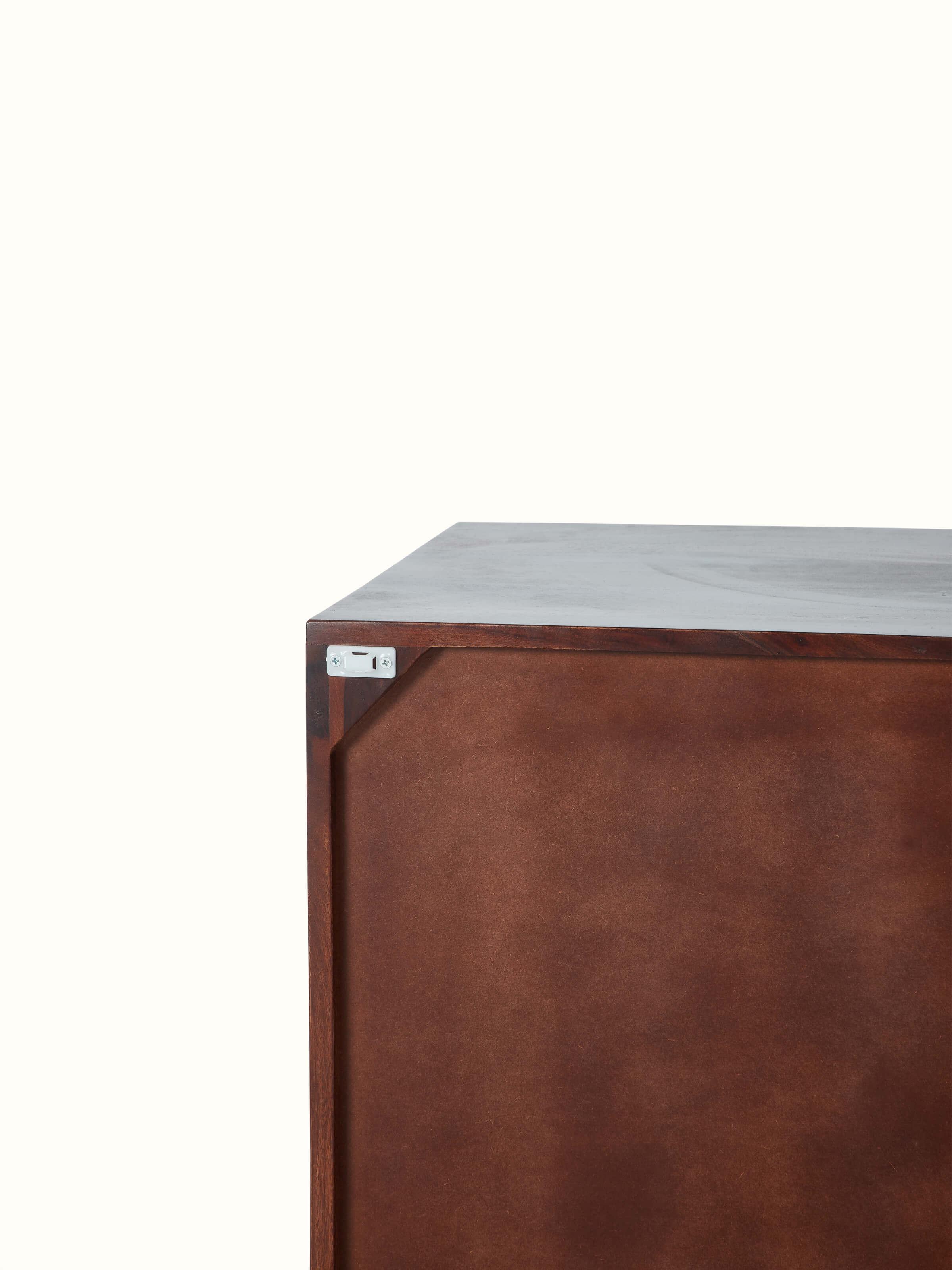 Detailed view of the Sheesham wood and cane bar cabinet’s base and legs, highlighting the sturdy construction.