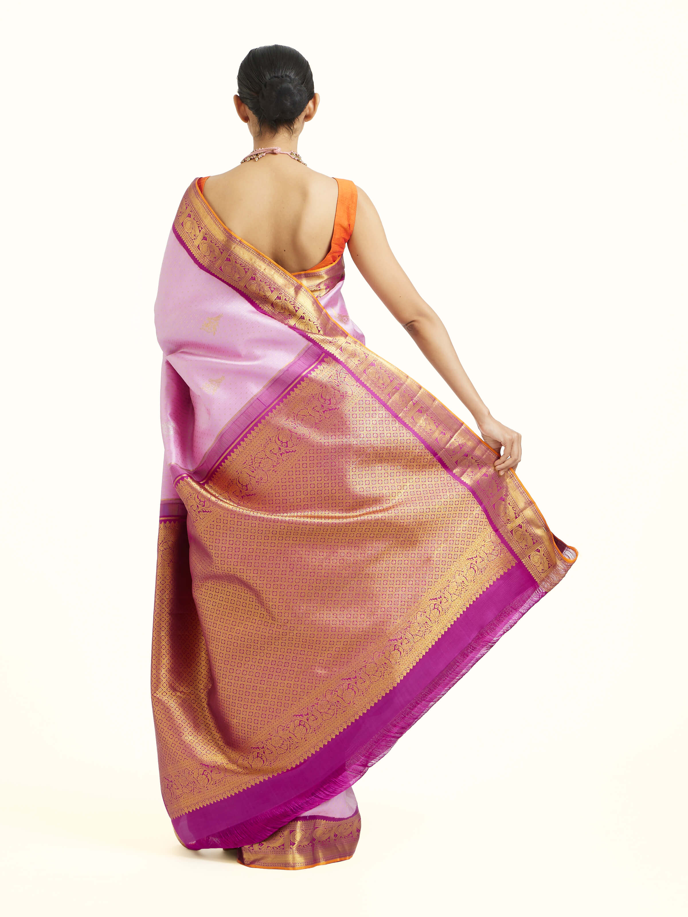Back view of lavender silk Kancheepuram saree displaying ornate pallu design