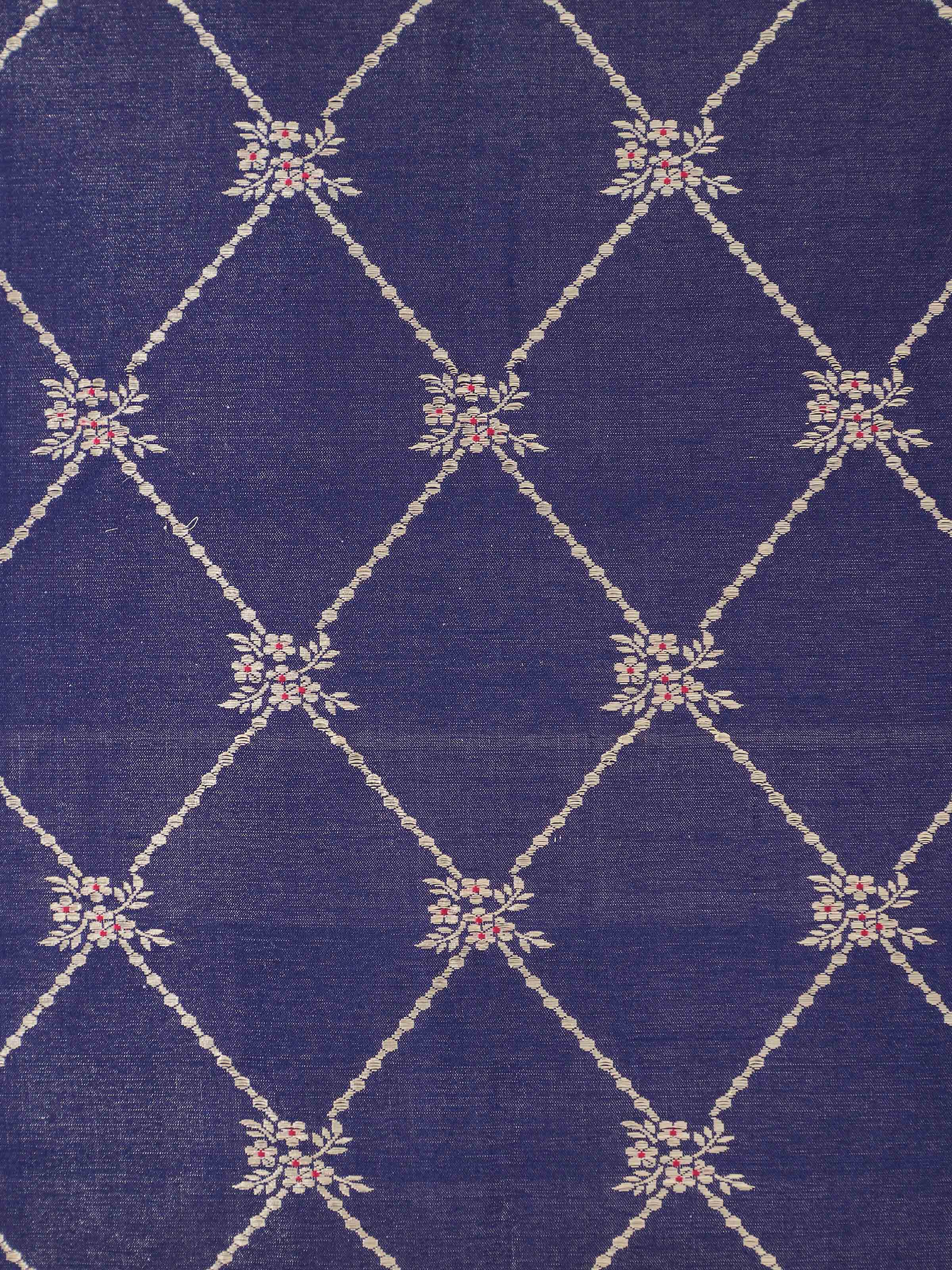 Side detail view of cushion cover showing handloom silk texture and ornamental border.