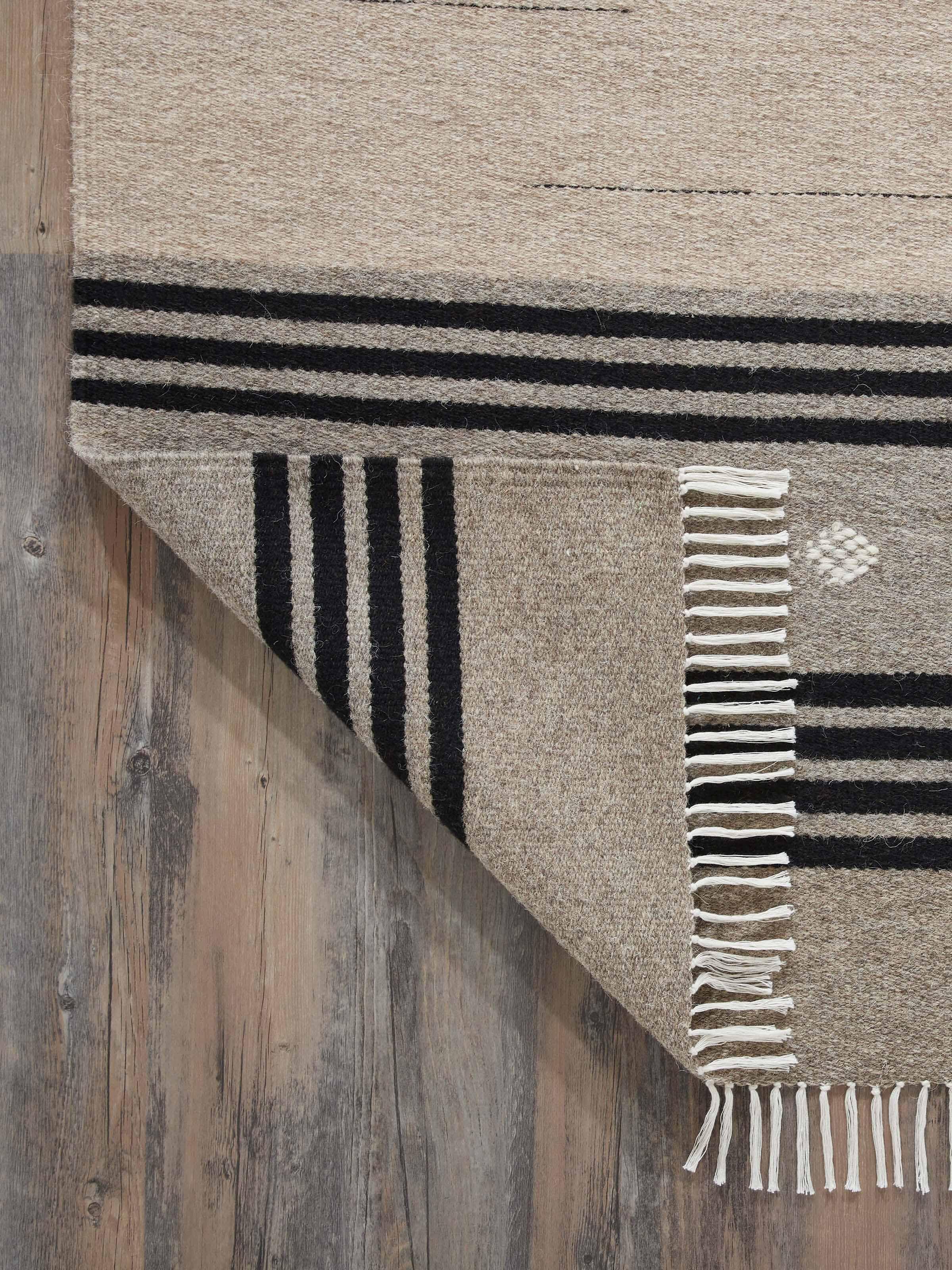 Detailed view of Nomad stripes beige black Jawaja wool & cotton handloom dhurrie (3x5 ft) showing the handloom craftsmanship and striped design