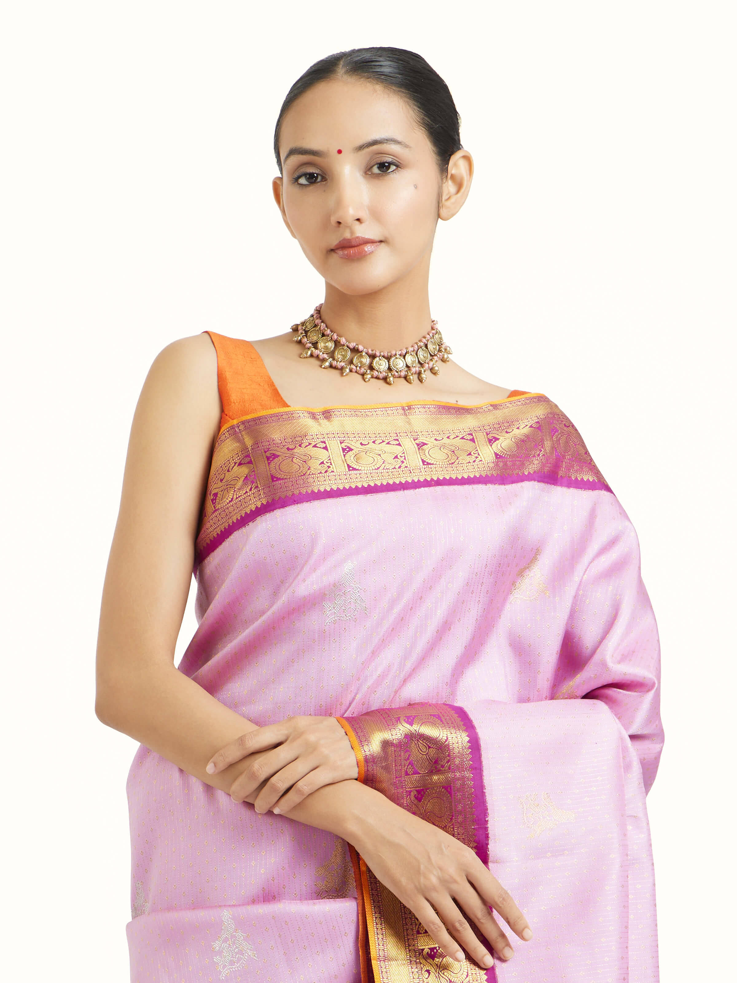 Angled view of lavender silk Kancheepuram saree highlighting traditional weave and sheen