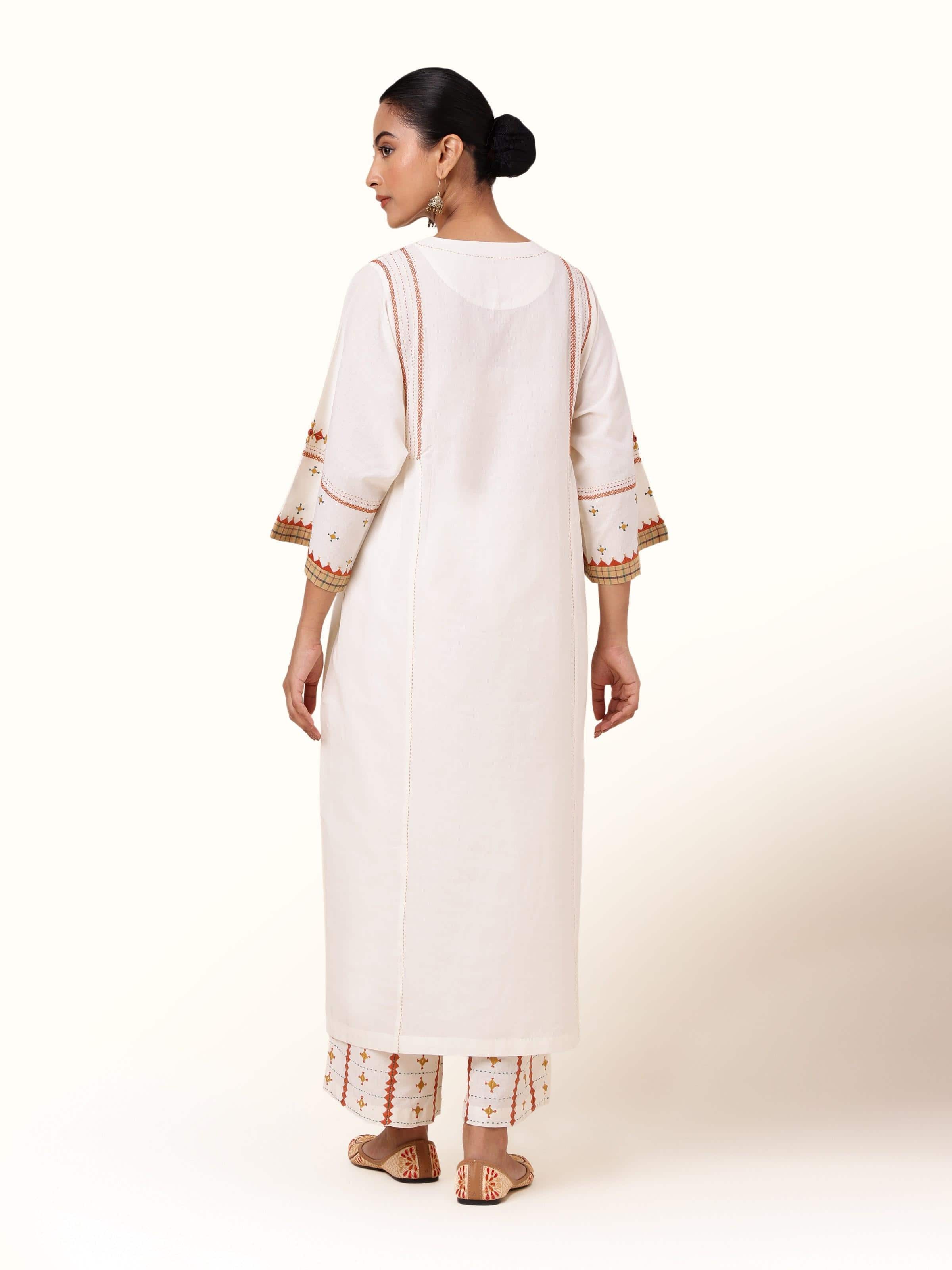 Back view of Off-white Cotton Rajasthani Embroidered Palazzo showing embroidery continuation and palazzo silhouette.