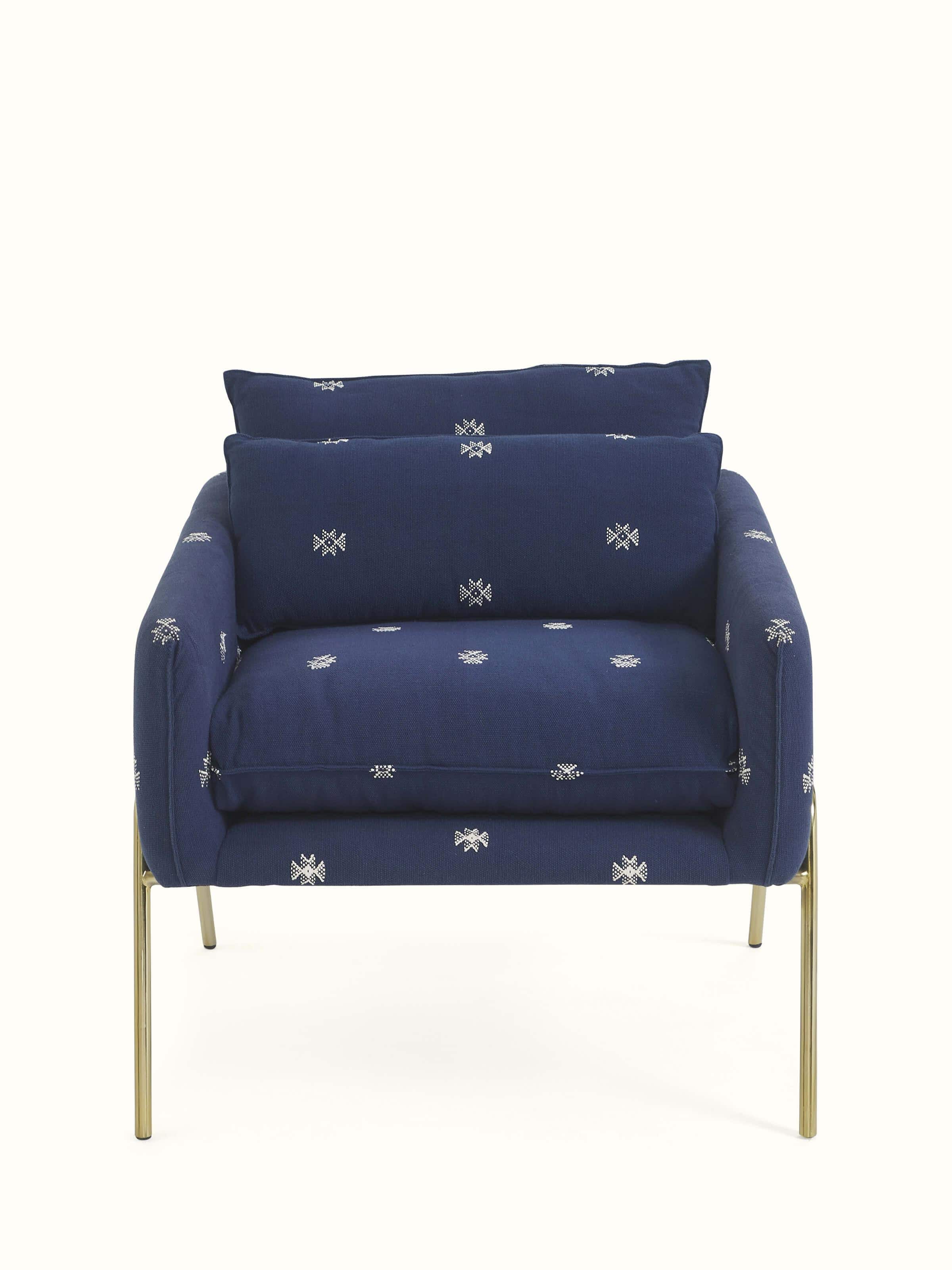 Front view of Upholstered Metal Armchair highlighting plush upholstery and sleek metal frame design.