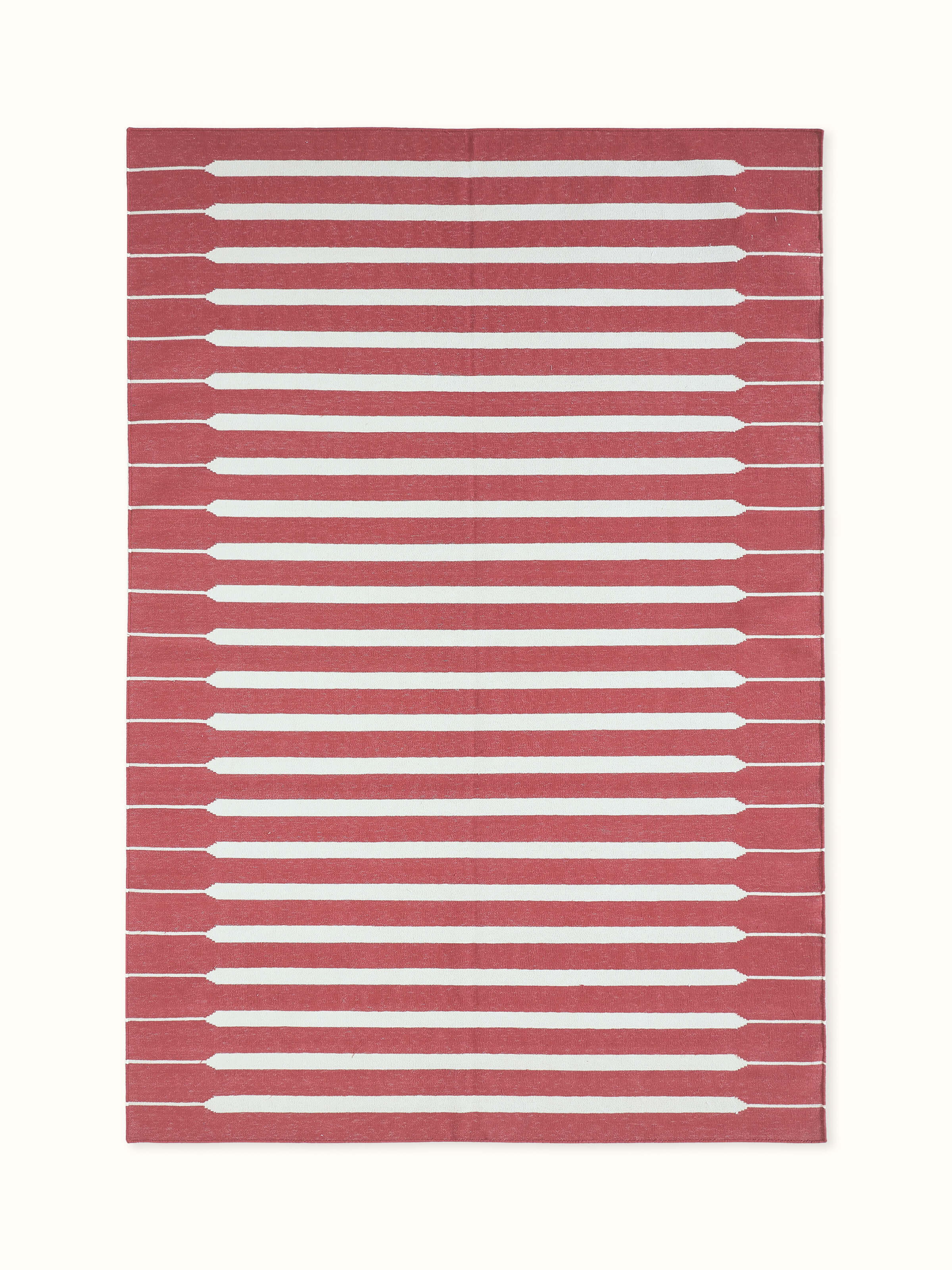 Front view showing the modern geometric red and ivory stripe pattern on Lawan cotton