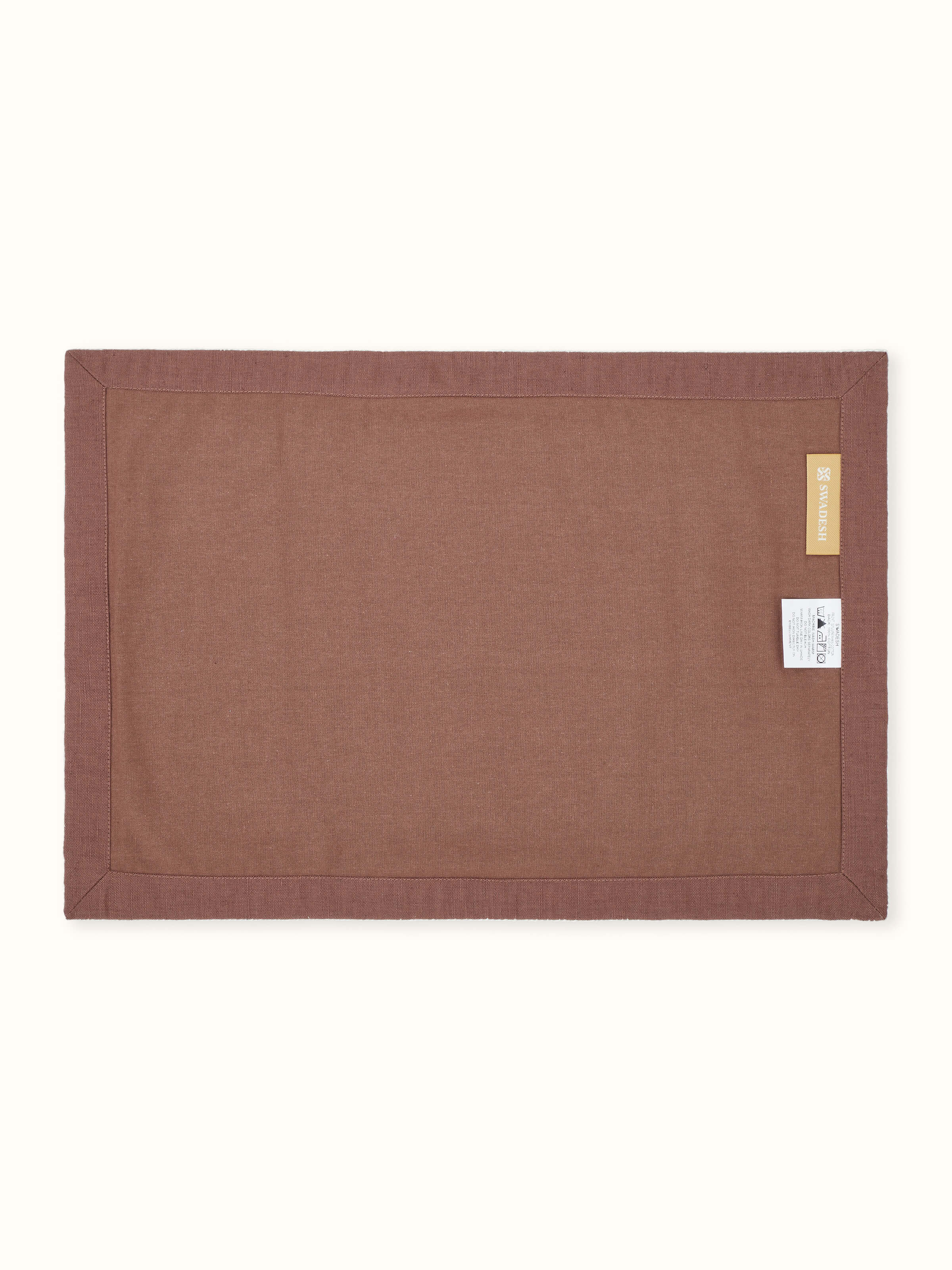 Back side view of Parvat brown edge stitch linen cotton table mat