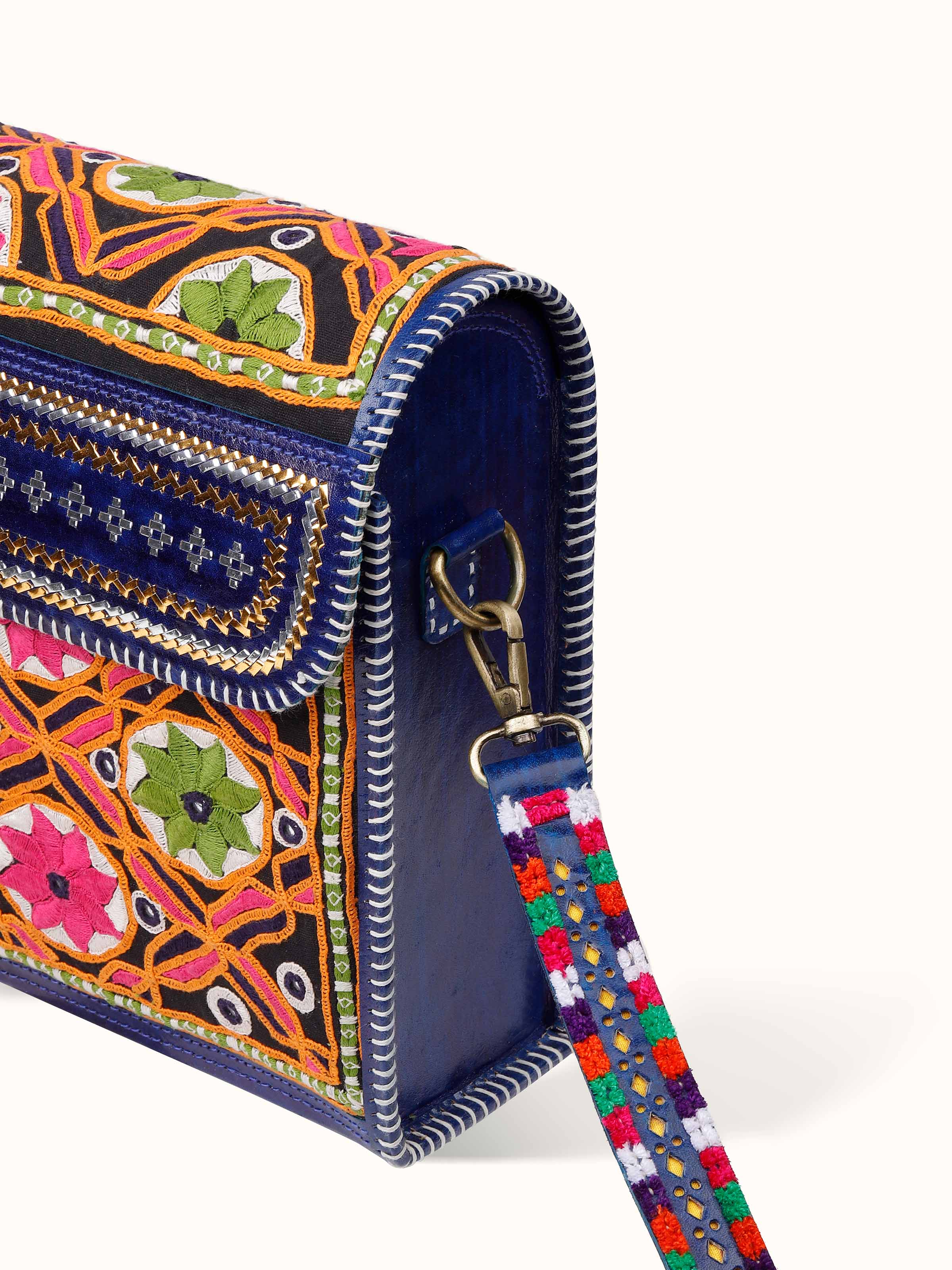 Overhead view of Kutchi Leather Embroidered Messenger Bag displaying handle and opening design.