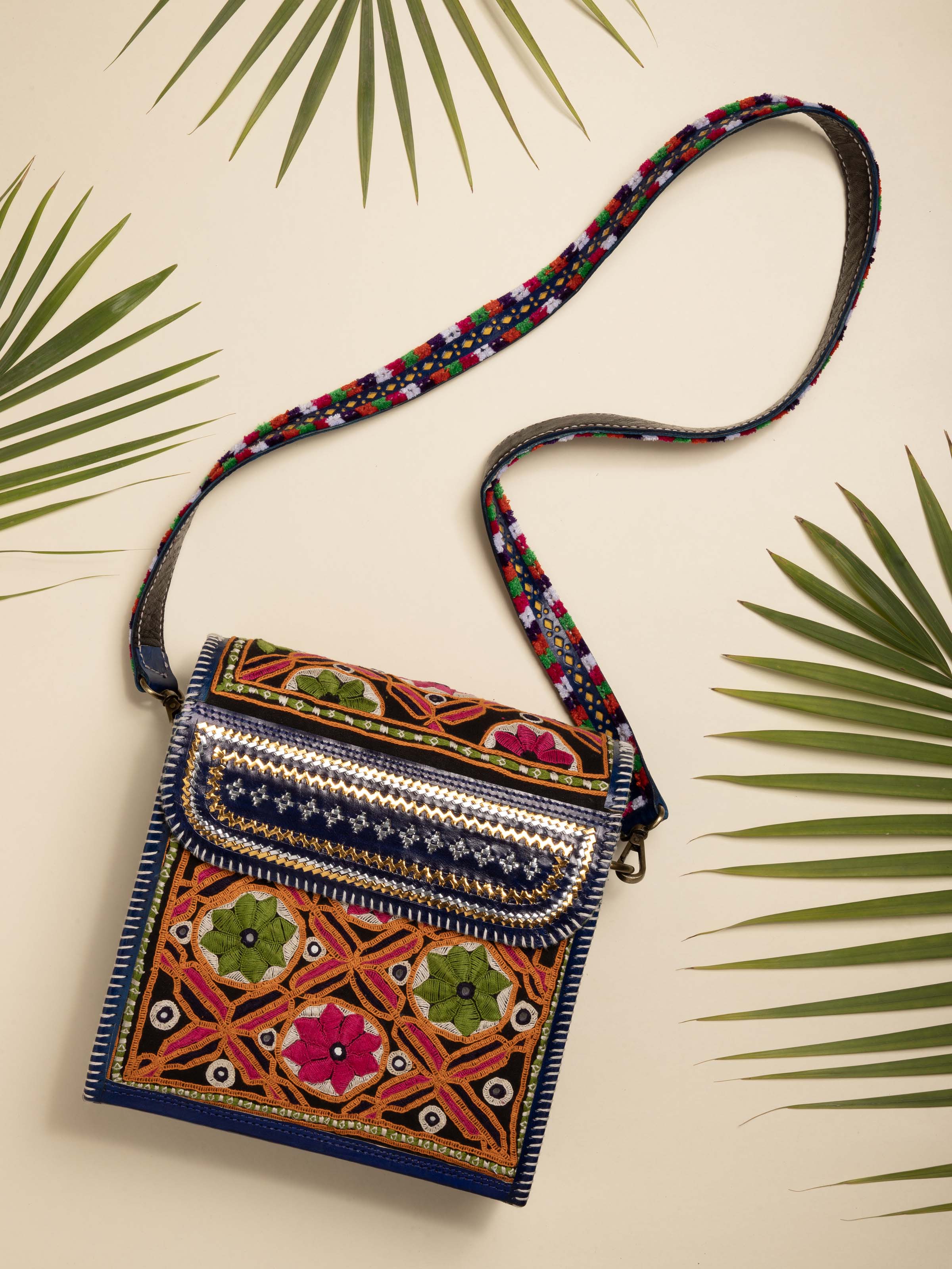Lifestyle view of Kutchi Leather Embroidered Messenger Bag carried casually highlighting detailed embroidery and sturdy leather.
