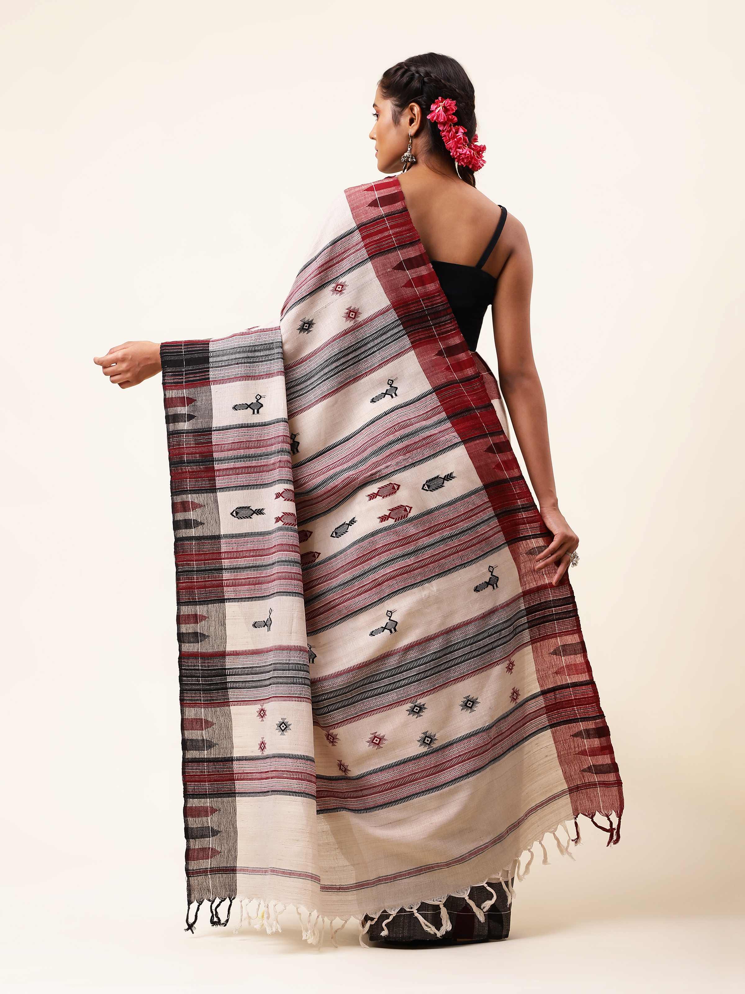 Back view of the saree showing full-length flow and minimal design.