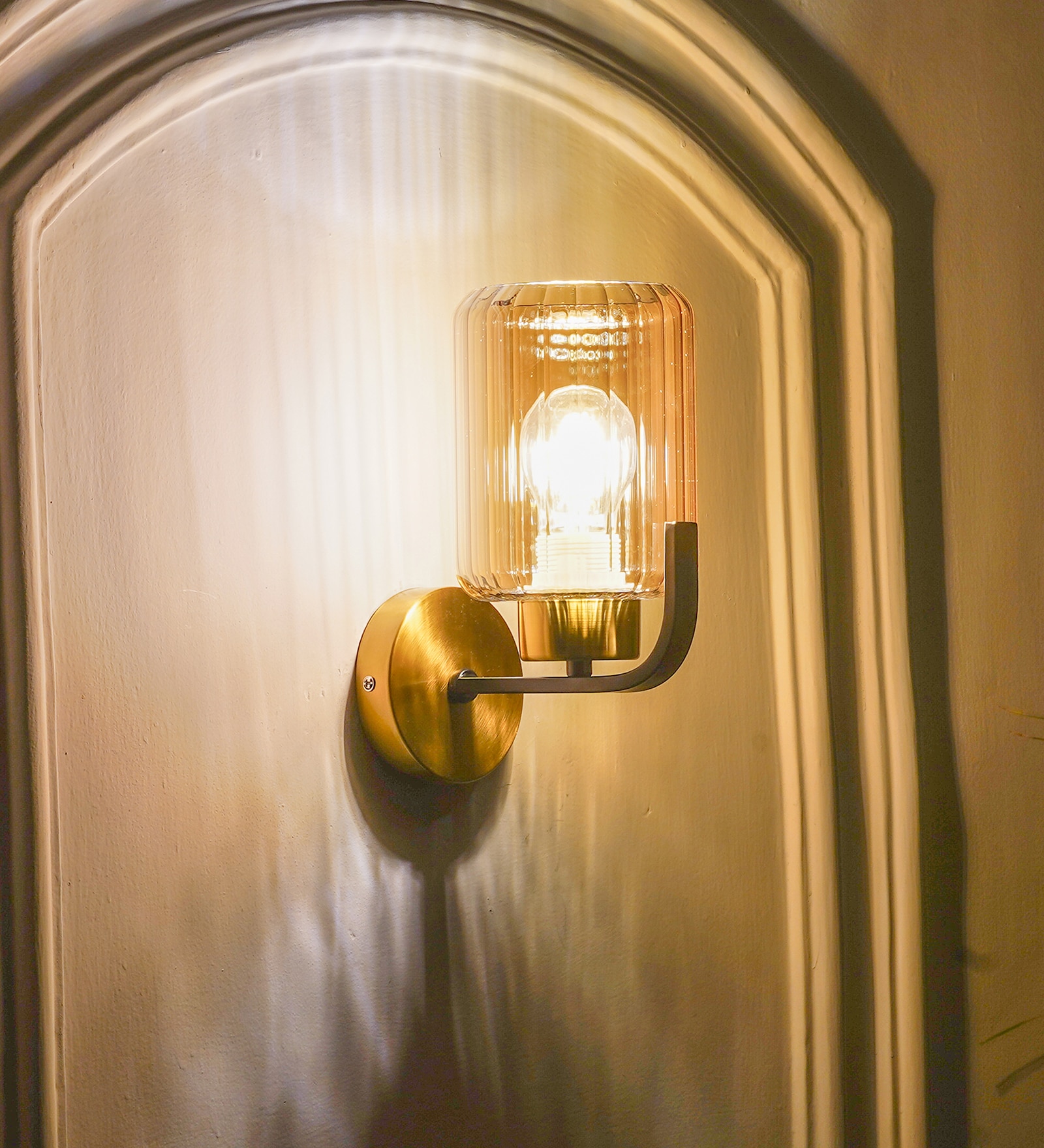 Isabella Single Light Wall Fitting In Black And  Brass  Finish Metal With Amber Glass