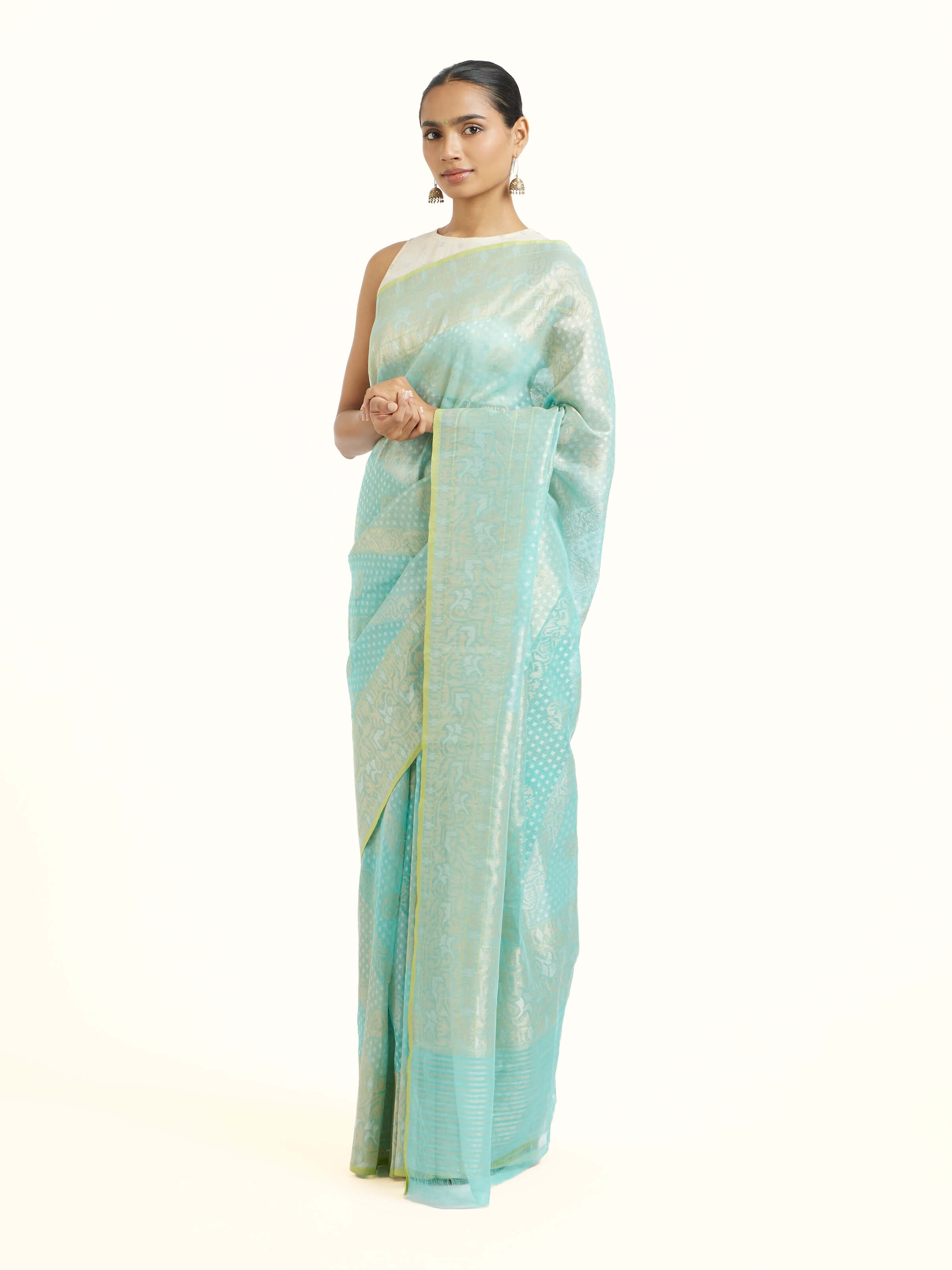 Side view of turquoise cotton Awadh Jamdani Banarasi saree showcasing weave texture