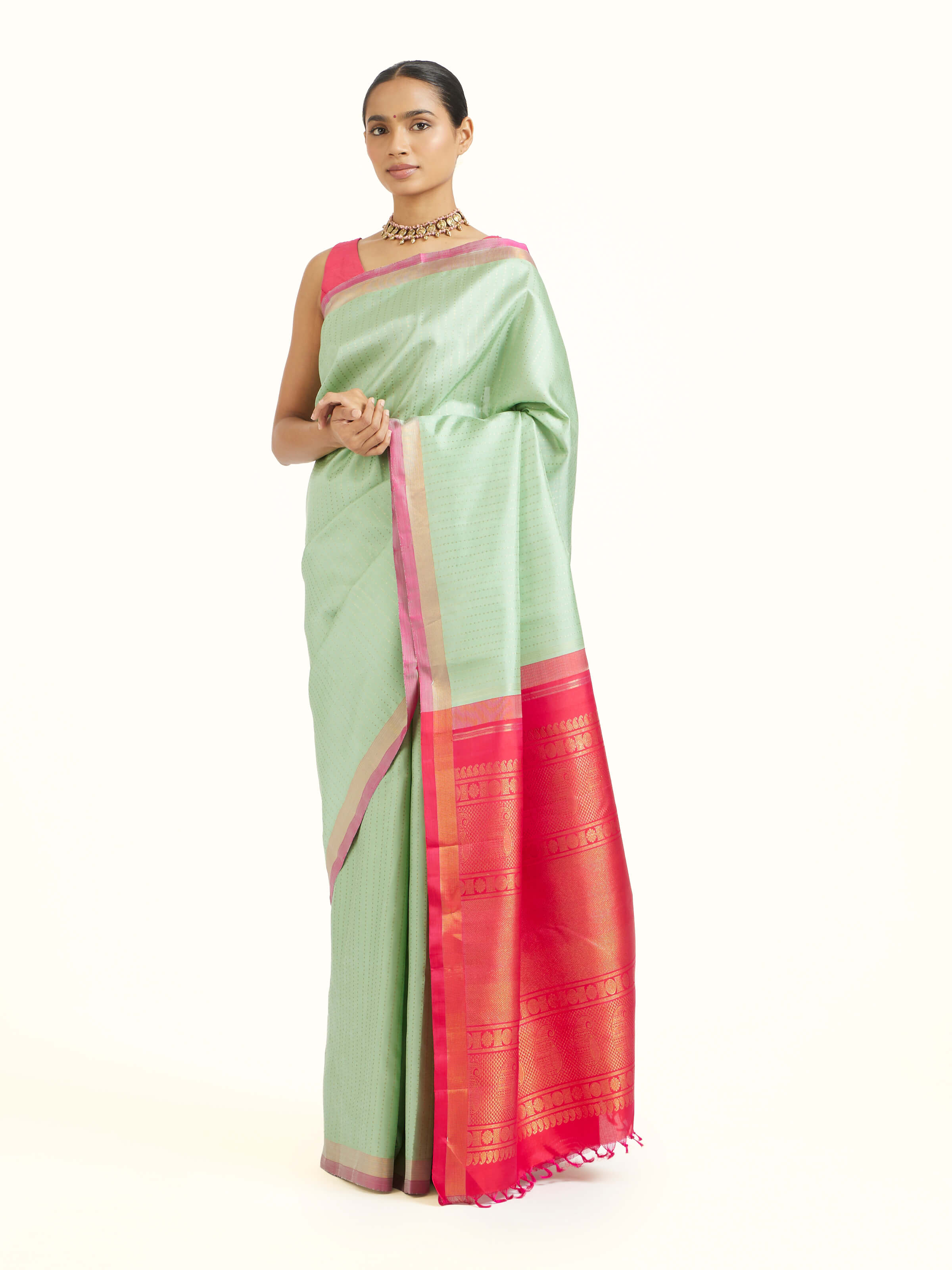 Side view of light green silk Kancheepuram saree showcasing graceful drape