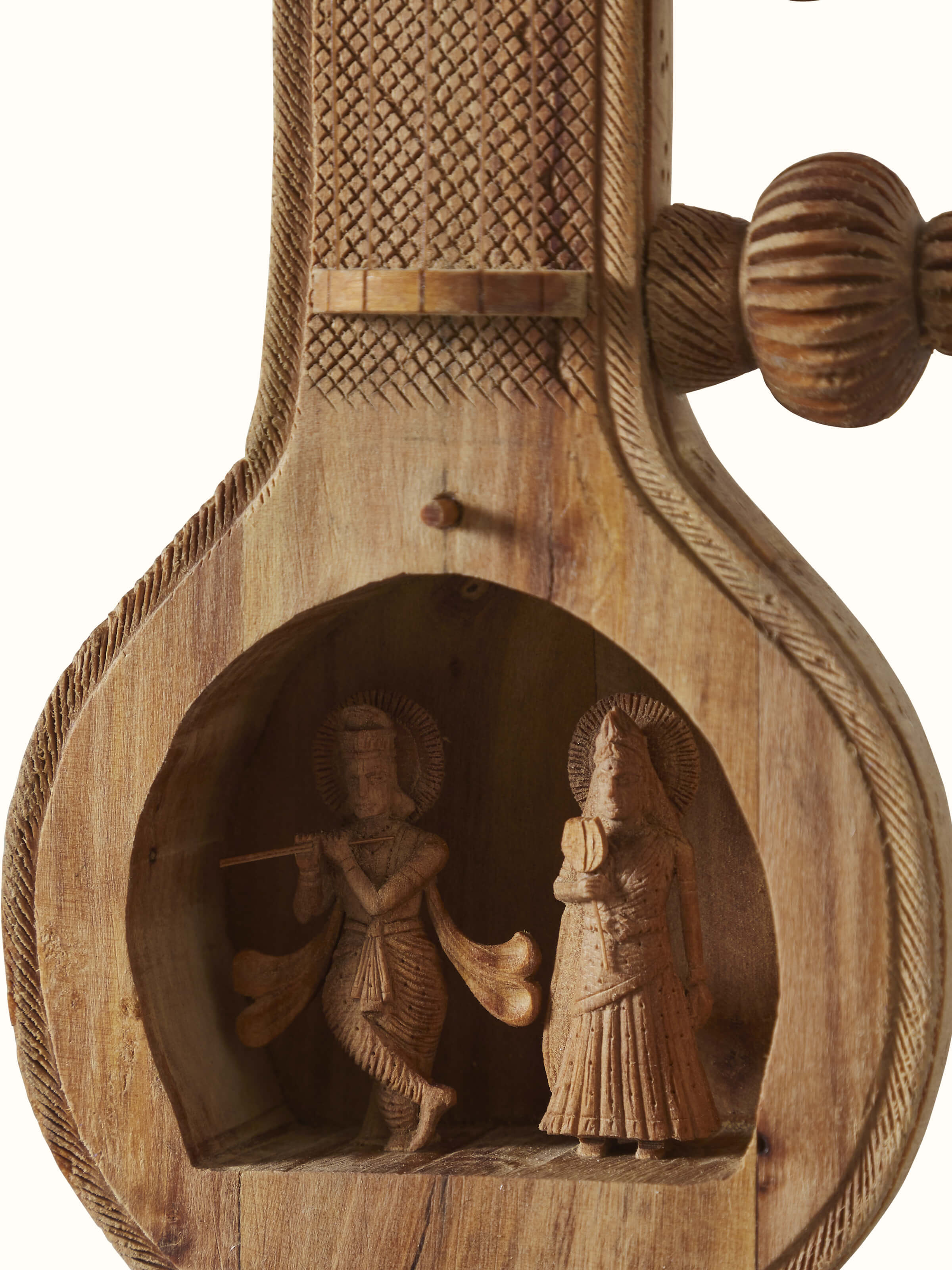 Detailed close-up of carved sandalwood Vandana Veena sculpture highlighting its artistic elements