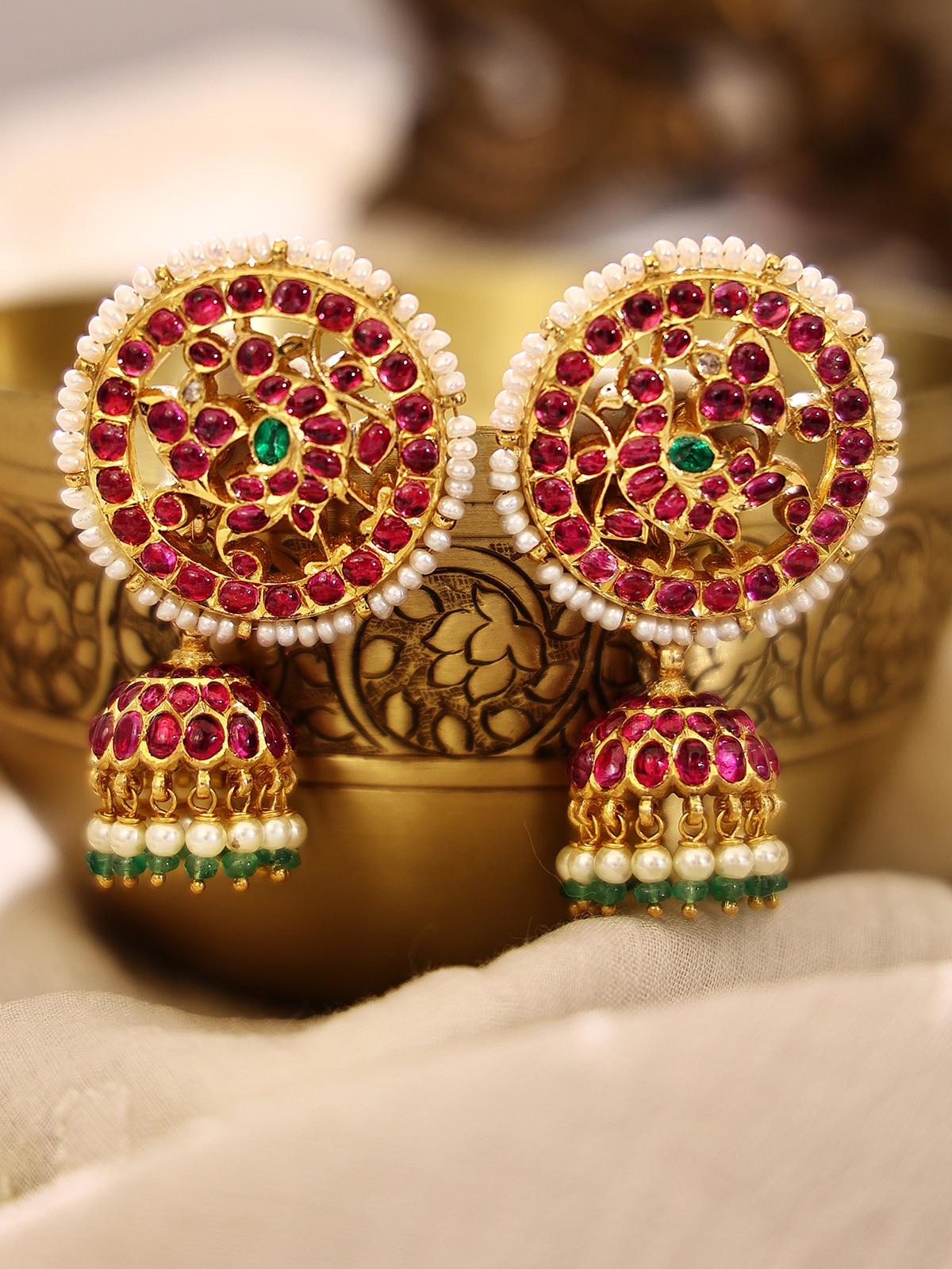 Side view of Kundala Velai 22 Karat Gold Jhumkas highlighting its intricate craftsmanship and gold sheen