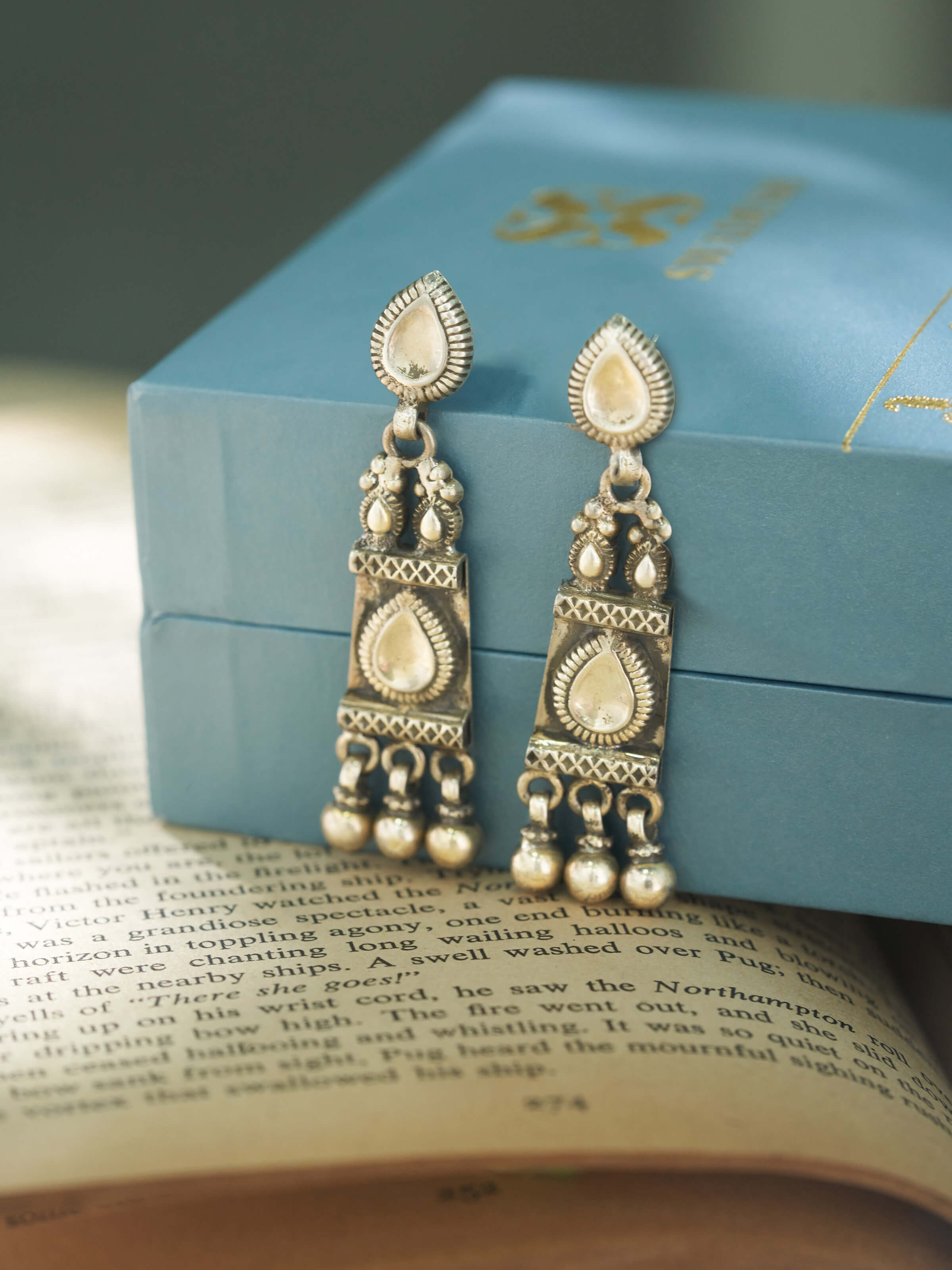 Top view of Smithing drop earrings displaying craftsmanship