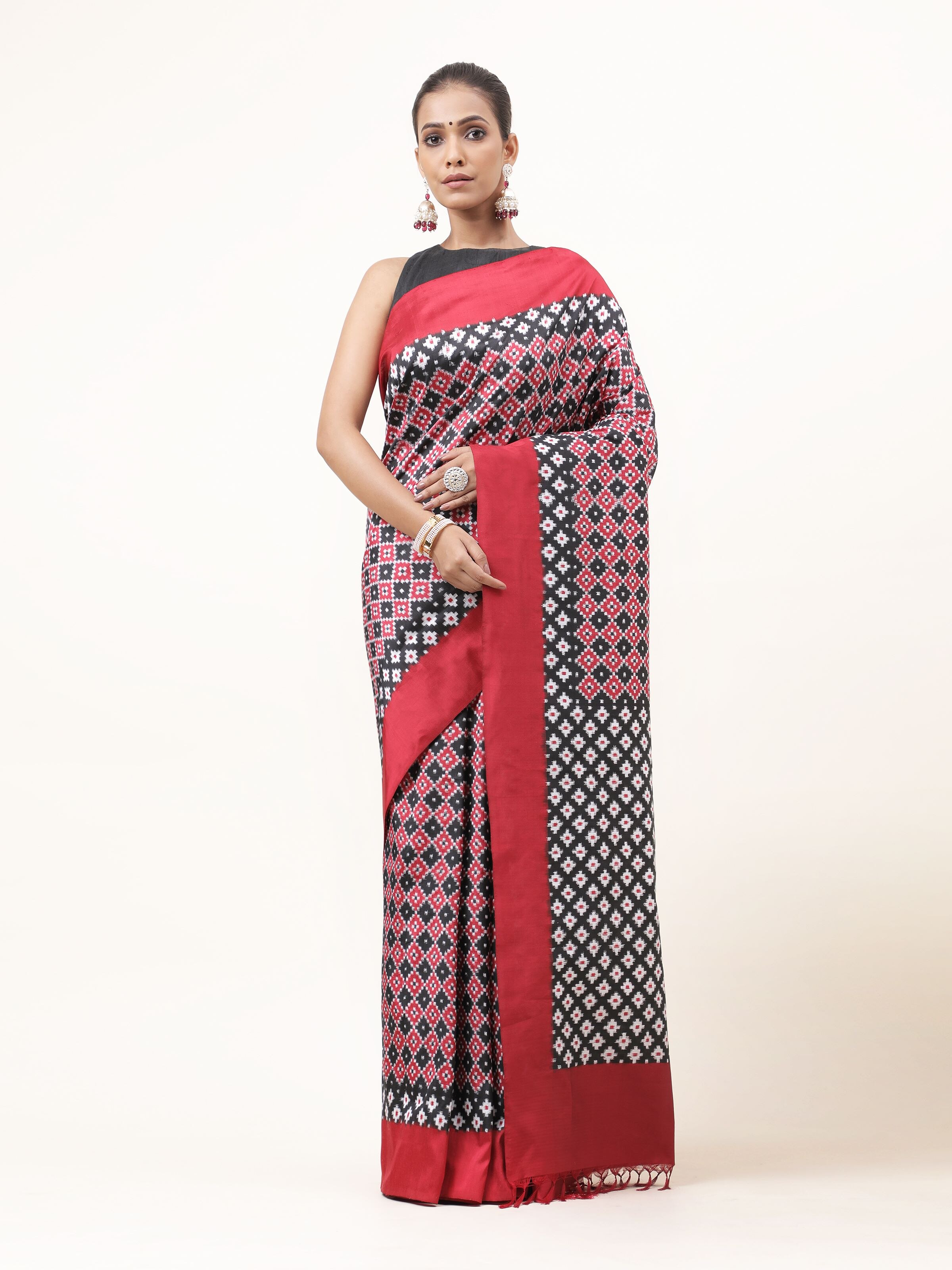 Front view of black silk Telia Rumal saree featuring intricate double Ikat motifs