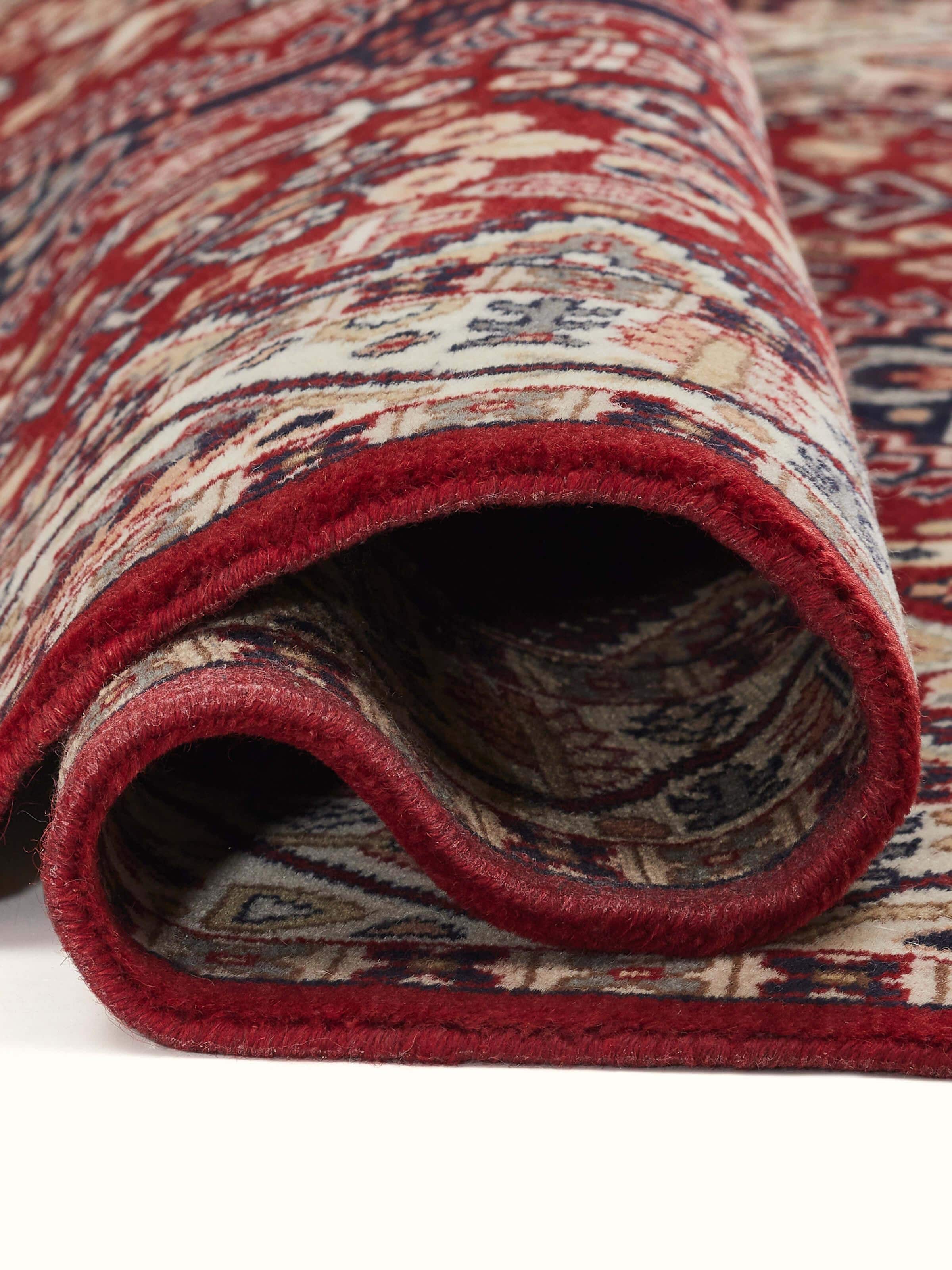 Side texture detail of Persian-style Kazak carpet in warm rust tones