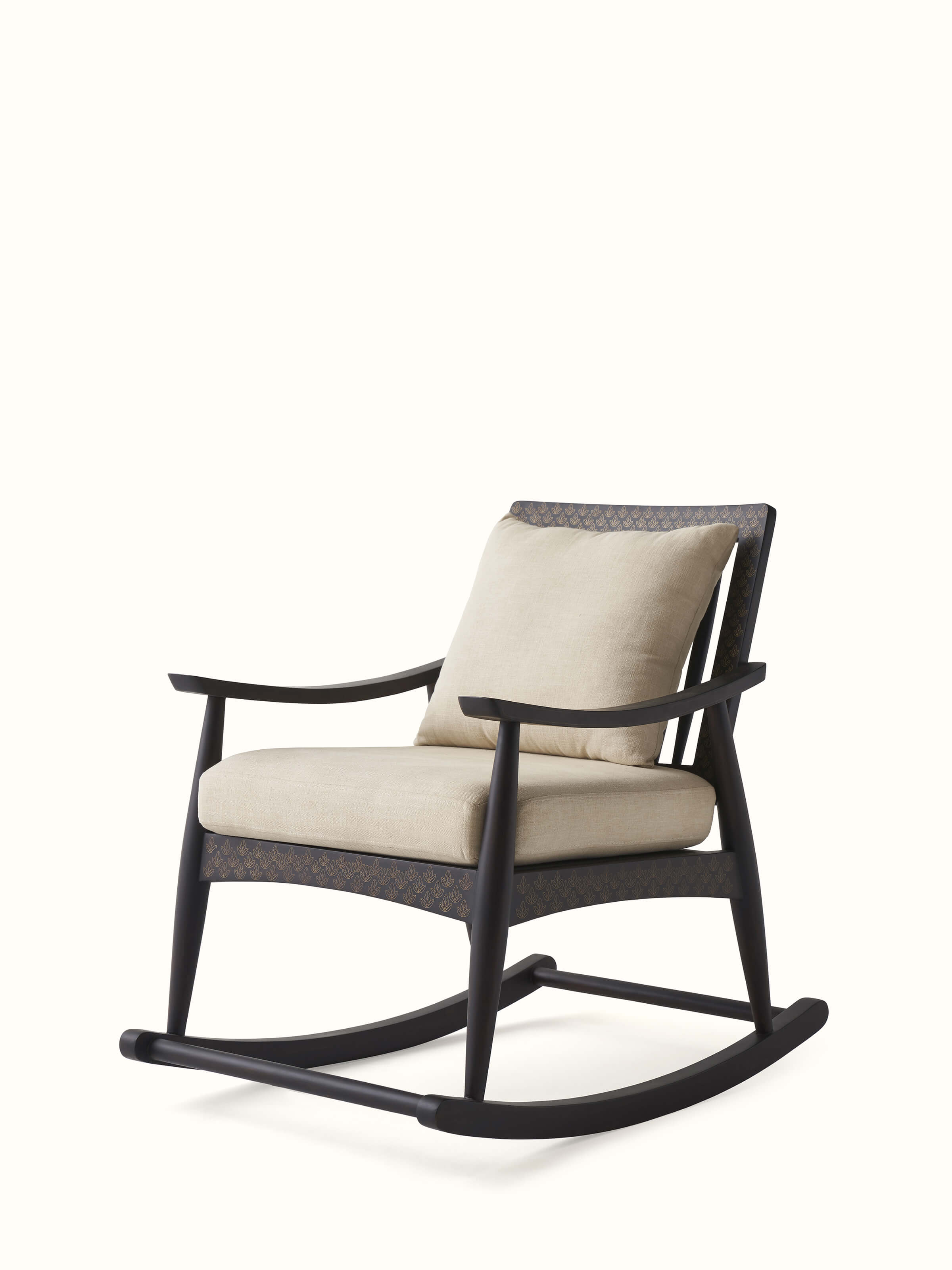 Close-up of the brass tarkashi inlay on the Sheesham wood rocking chair, emphasizing the fine detailing and artistic craftsmanship.