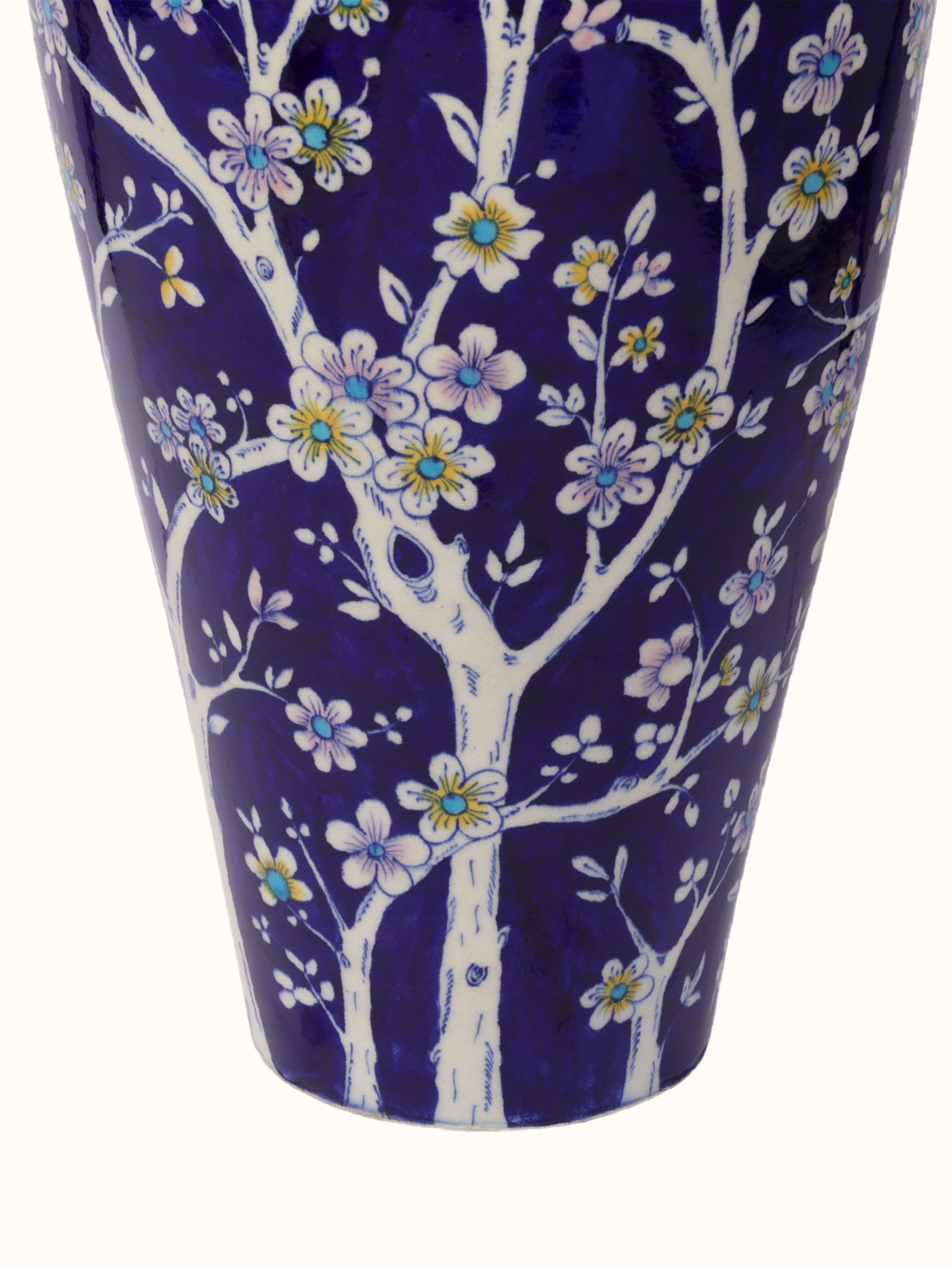 Close-up detail view of blue pottery table vase craftsmanship