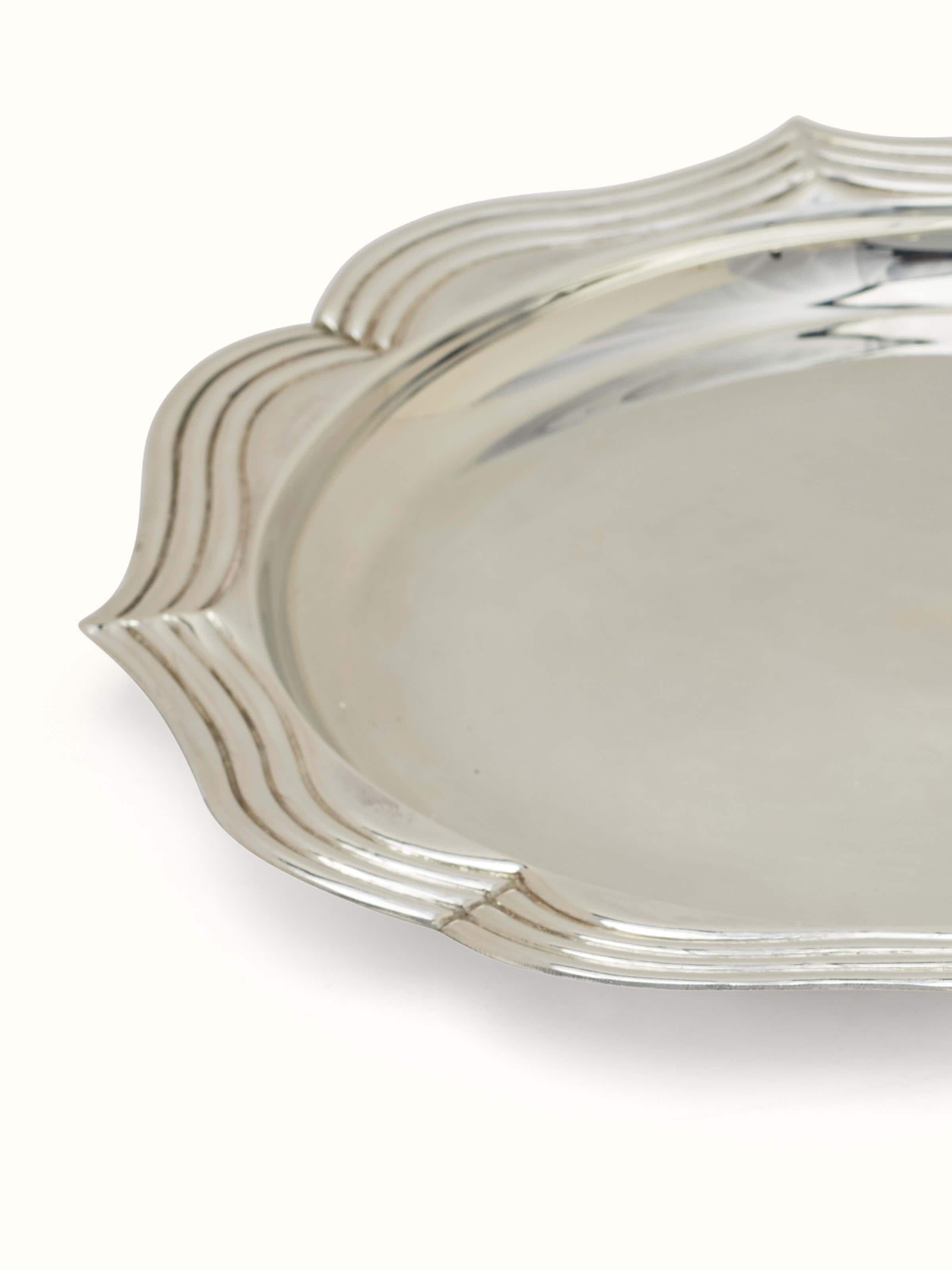 Detail shot of Chitai silver pooja thali set (7 pcs) with intricate design