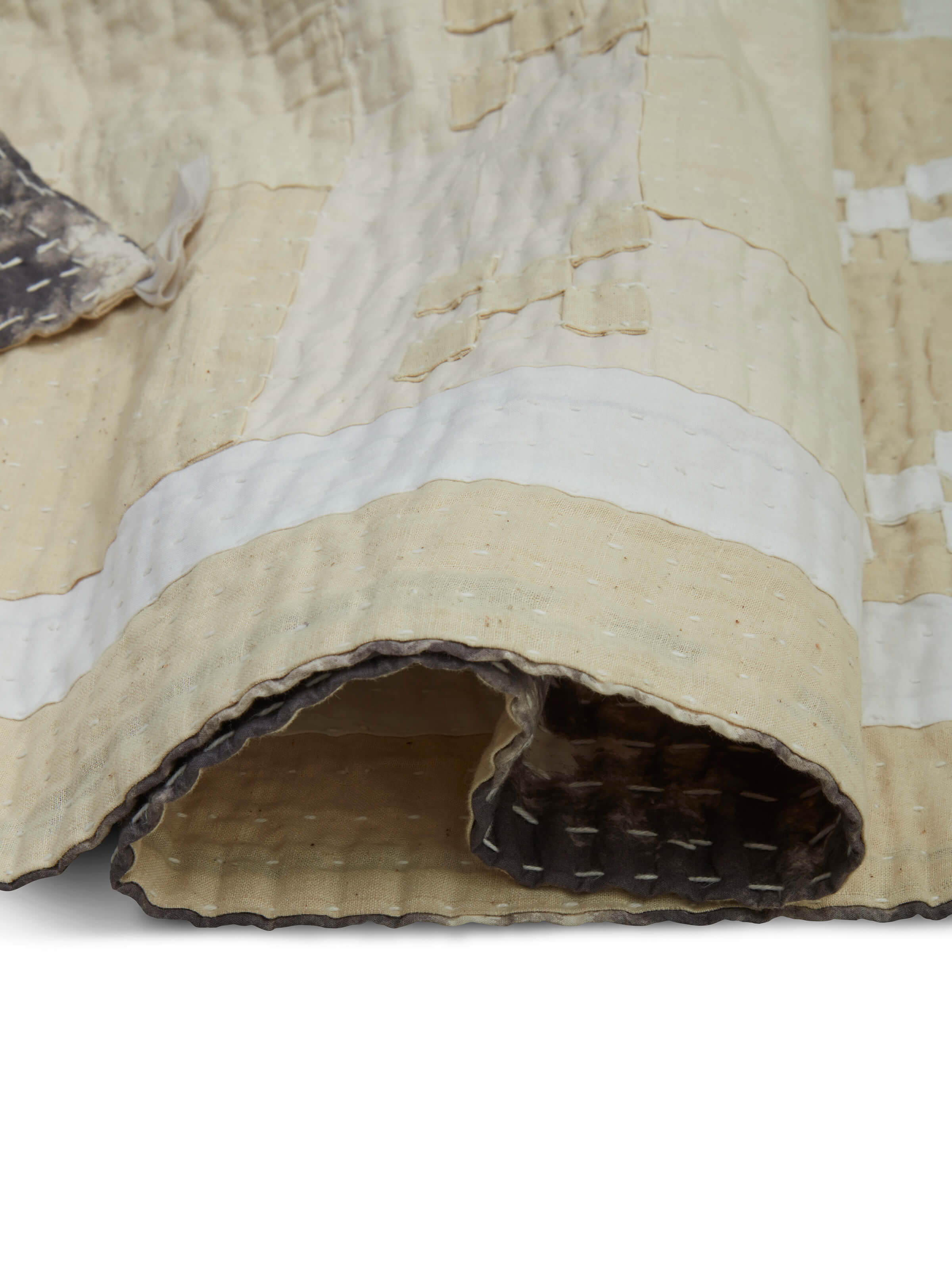 Texture and patchwork pattern detail of Siddi single bedspread